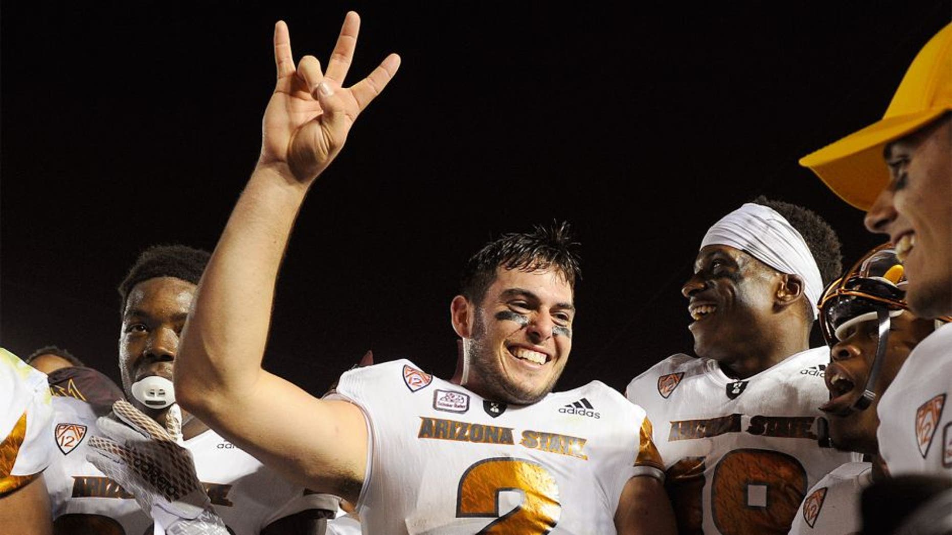 PASADENA, CA - OCTOBER 3: Quarterback Mike Bercovici #2 of the Arizona State Sun Devils and teammate celebrate the upset win over UCLA Bruins, 38-23, at the Rose Bowl October 3, 2015, in Pasadena, California. (Photo by Kevork Djansezian/Getty Images)