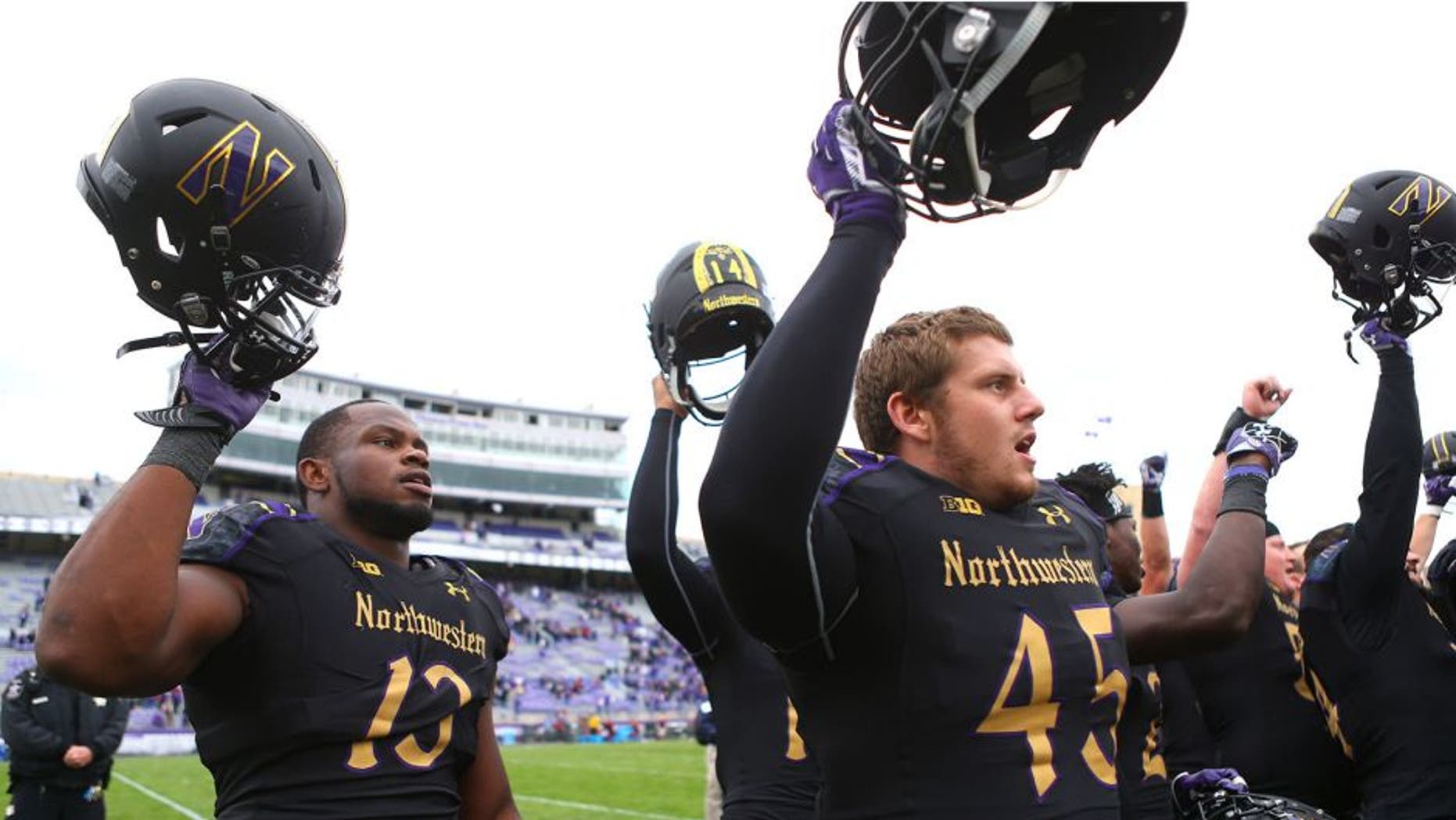 Oct 3, 2015; Evanston, IL, USA; Northwestern Wildcats defensive lineman Deonte Gibson (13) celebrates with teammates after defeating the Minnesota Golden Gophers at Ryan Field. Mandatory Credit: Caylor Arnold-USA TODAY Sports