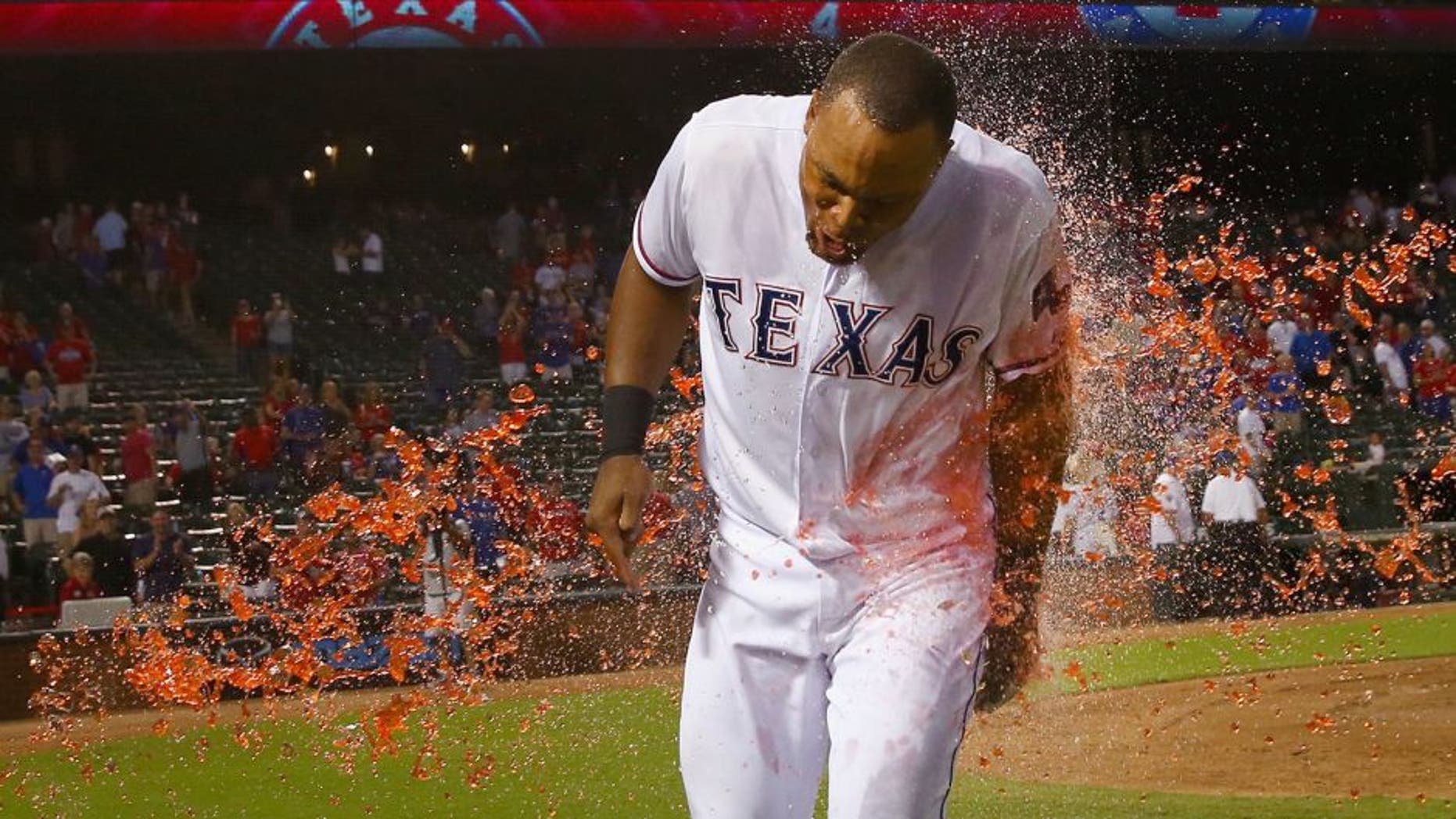 ARLINGTON, TX - SEPTEMBER 29: Adrian Beltre #29 of the Texas Rangers is soaked with PowerAid after the Rangers beat the Detroit Tigers 7-6 at Globe Life Park in Arlington on September 29, 2015 in Arlington, Texas. (Photo by Tom Pennington/Getty Images)