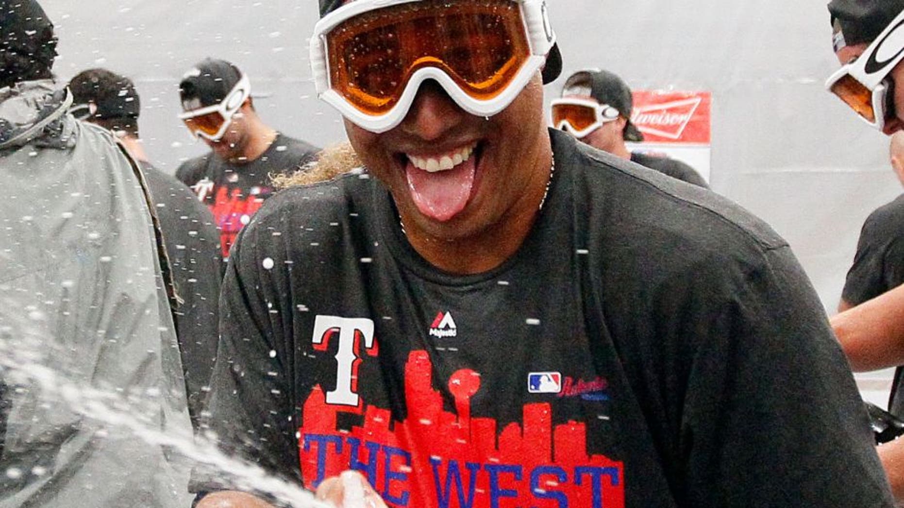ARLINGTON, TX - OCTOBER 4: Leonys Martin of the Texas Rangers celebrates winning the team's sixth AL West Title after a baseball game against the Los Angeles Angels at Globe Life Park on October 4, 2015 in Arlington, Texas. Texas won 9-2. (Photo by Brandon Wade/Getty Images)