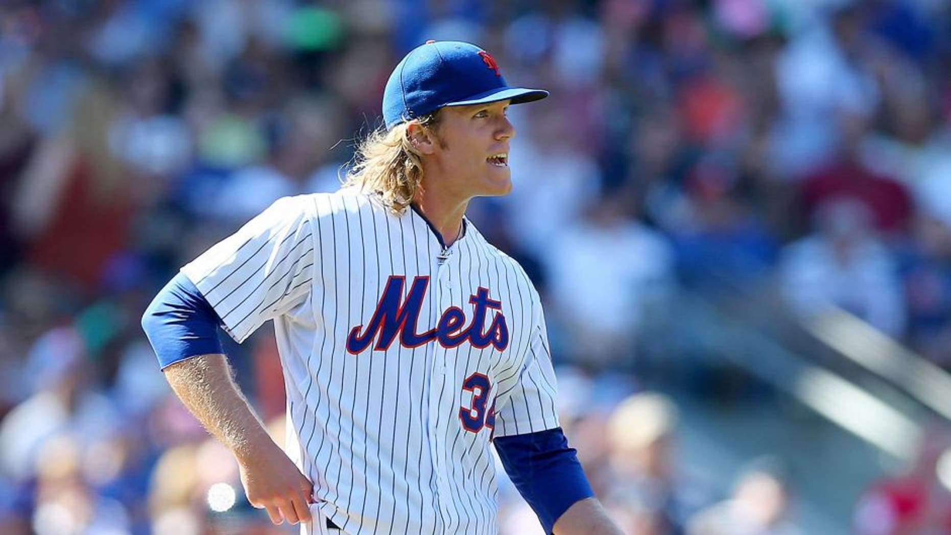 NEW YORK, NY - SEPTEMBER 19: Noah Syndergaard #34 of the New York Mets reacts in the sixth inning against the New York Yankees during interleague play on September 19, 2015 at Citi Field in the Flushing neighborhood of the Queens borough of New York City. (Photo by Elsa/Getty Images)