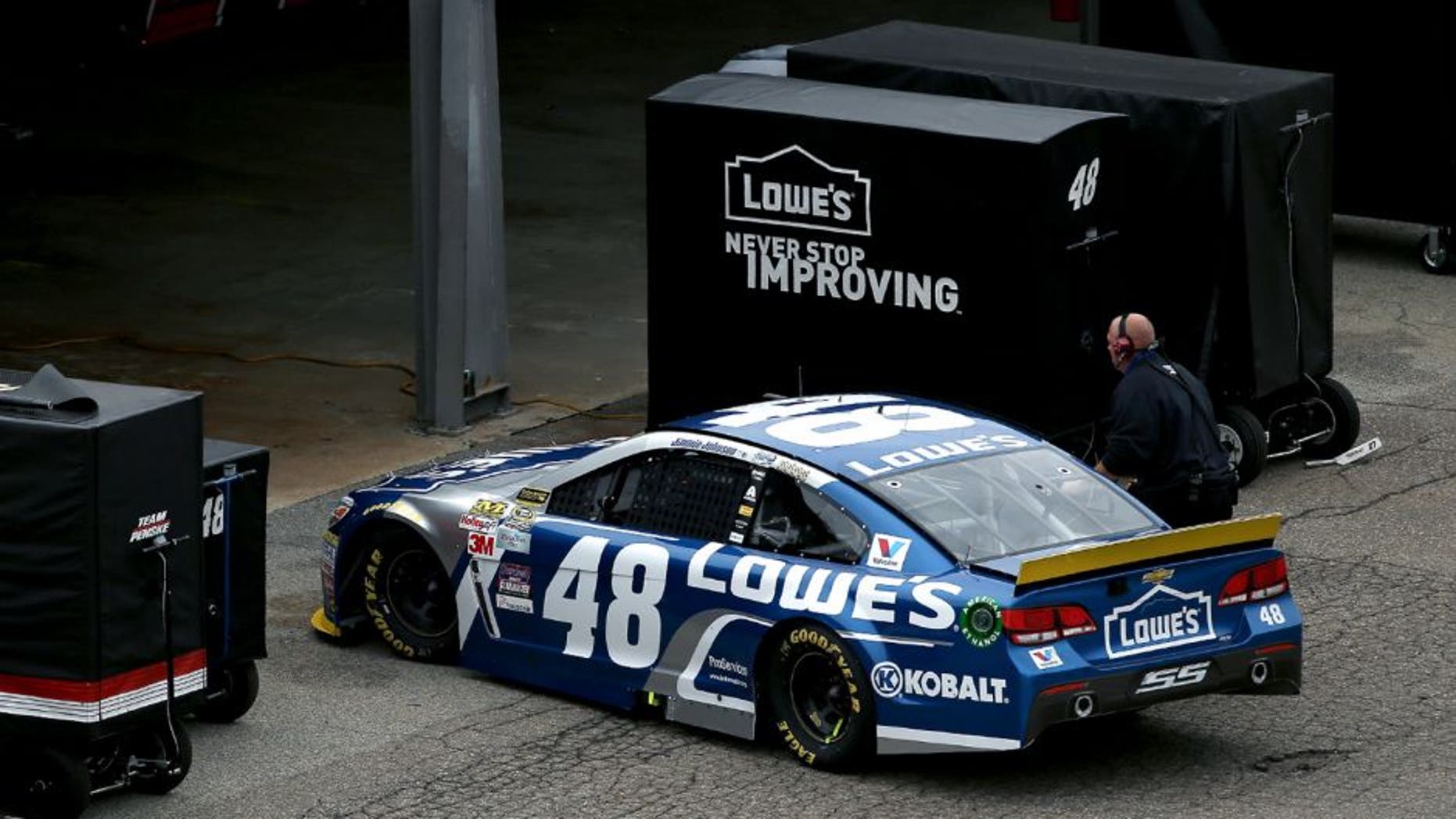 DOVER, DE - OCTOBER 04: Jimmie Johnson, driver of the #48 Lowe's Chevrolet, drives into his garage during the NASCAR Sprint Cup Series AAA 400 at Dover International Speedway on October 4, 2015 in Dover, Delaware. (Photo by Patrick Smith/Getty Images)