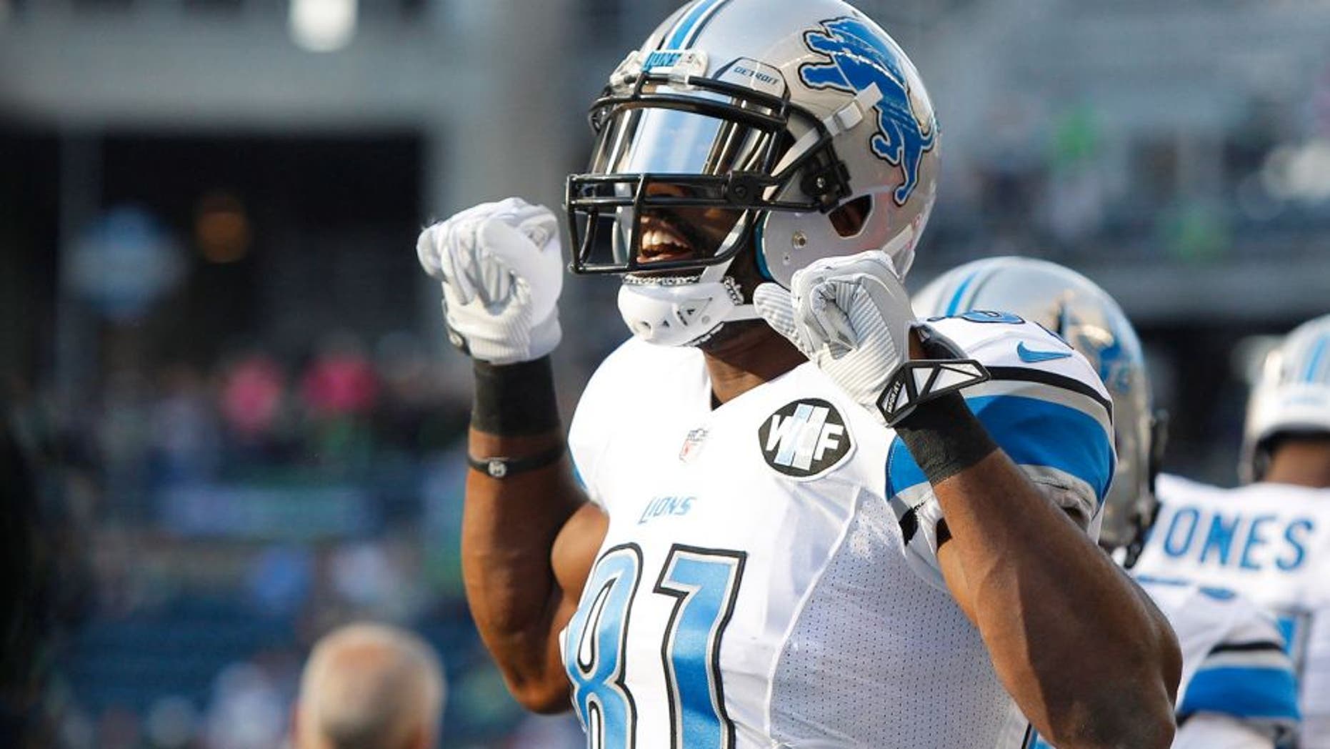 Oct 5, 2015; Seattle, WA, USA; Detroit Lions wide receiver Calvin Johnson (81) greets his teammates during pre game warmups against the Seattle Seahawks at CenturyLink Field. Mandatory Credit: Joe Nicholson-USA TODAY Sports
