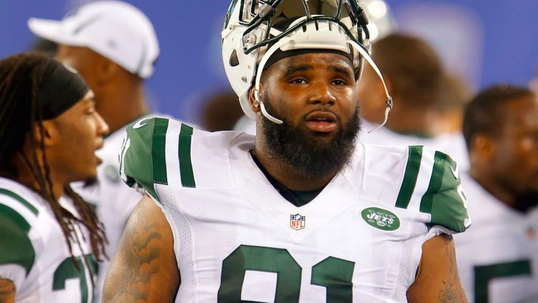 Aug 29, 2015; East Rutherford, NJ, USA; New York Jets defensive end Sheldon Richardson (91) on the sidelines during the second half against the New York Giants at MetLife Stadium. Mandatory Credit: Noah K. Murray-USA TODAY Sports