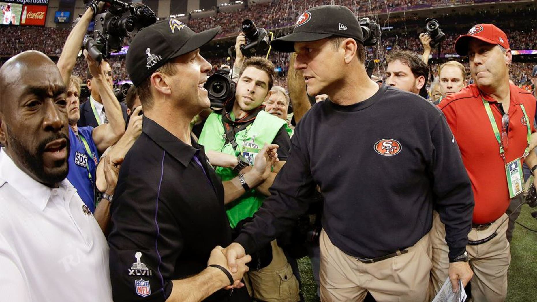 NEW ORLEANS, LA - FEBRUARY 03: Head coach John Harbaugh of the Baltimore Ravens shakes hands with his brother head coach Jim Harbaugh of the San Francisco 49ers after winning Super Bowl XLVII at the Mercedes-Benz Superdome on February 3, 2013 in New Orleans, Louisiana. The Ravens defeated the 49ers 34-31. (Photo by Ezra Shaw/Getty Images)