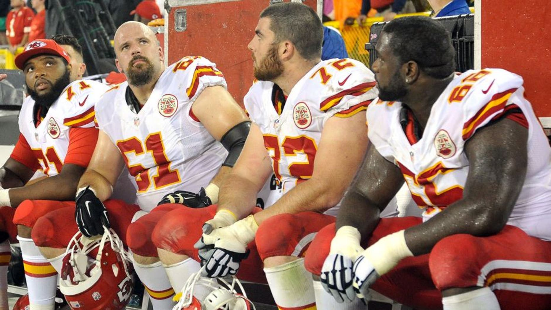 Sep 28, 2015; Green Bay, WI, USA; Kansas City Chiefs offensive tackle Jeff Allen (71), center Mitch Morse (61), offensive tackle Eric Fisher (72) and guard Ben Grubbs (66) watch the final minutes of the game against the Green Bay Packers at Lambeau Field. Mandatory Credit: Benny Sieu-USA TODAY Sports