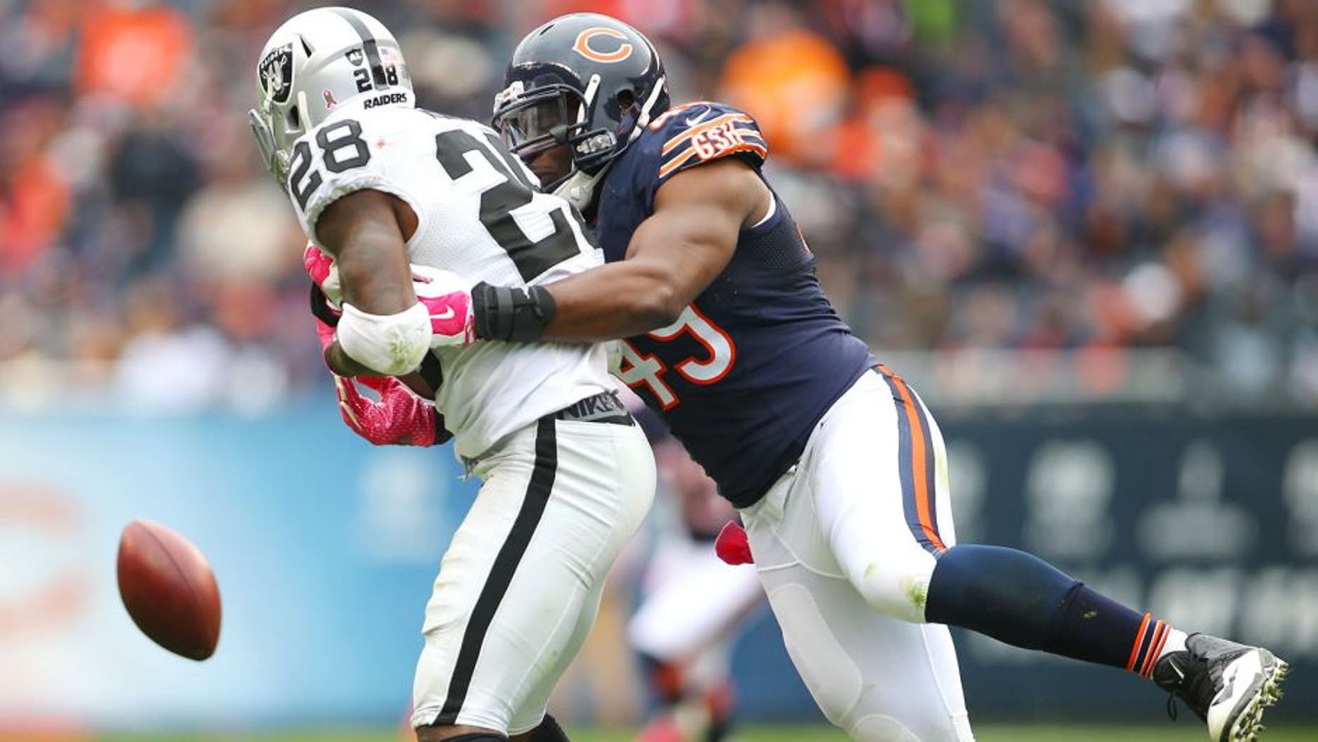 Oct 4, 2015; Chicago, IL, USA; Chicago Bears defensive end Sam Acho (49) breaks up a pass intended for Oakland Raiders running back Latavius Murray (28) during the second half at Soldier Field. Mandatory Credit: Jerry Lai-USA TODAY Sports