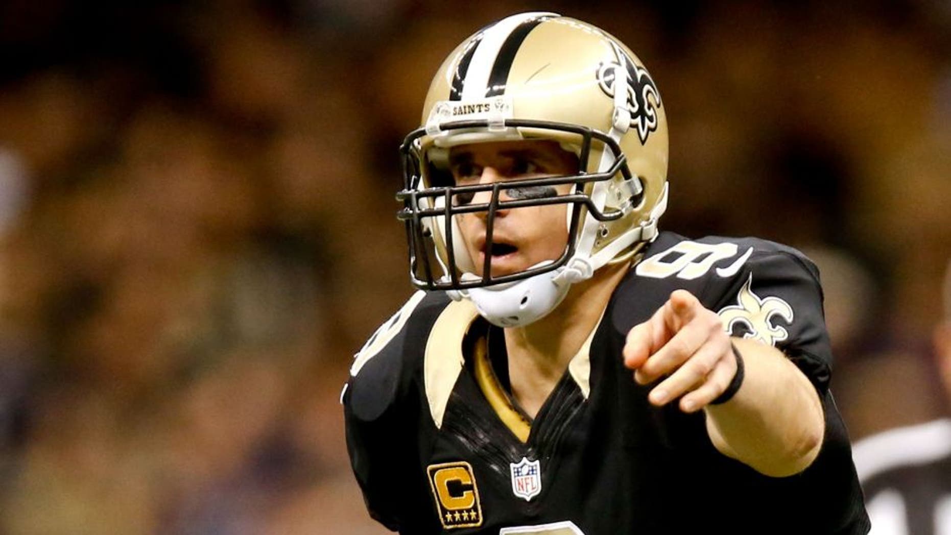 Nov 24, 2014; New Orleans, LA, USA; New Orleans Saints quarterback Drew Brees (9) against the Baltimore Ravens during the second half of a game at the Mercedes-Benz Superdome. The Ravens defeated the Saints 34-27. Mandatory Credit: Derick E. Hingle-USA TODAY Sports