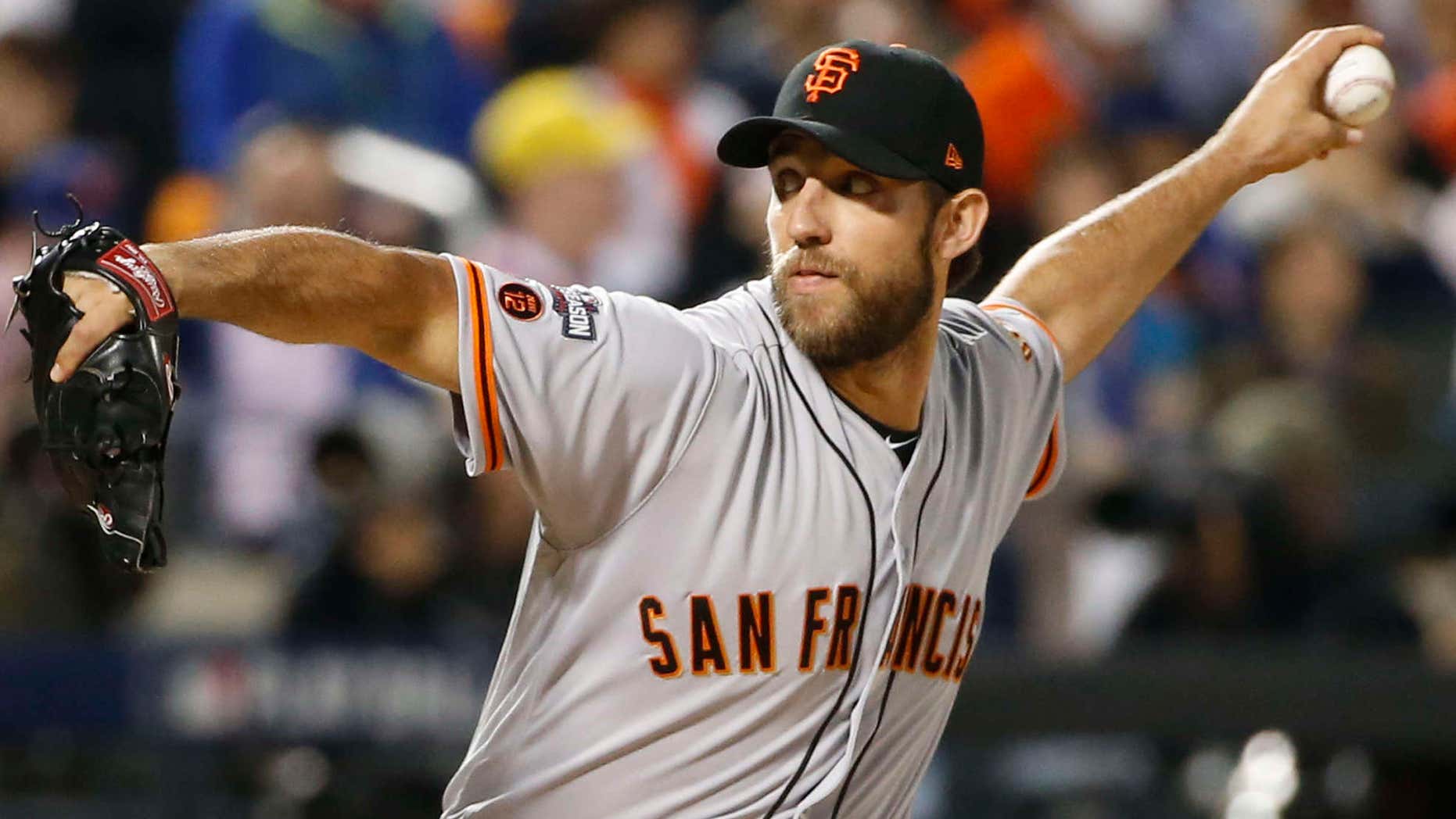 San Francisco Giants starting pitcher Madison Bumgarner (40) winds up during the first inning of a National League wild-card baseball game against the New York Mets on Wednesday, Oct. 5, 2016, in New York.