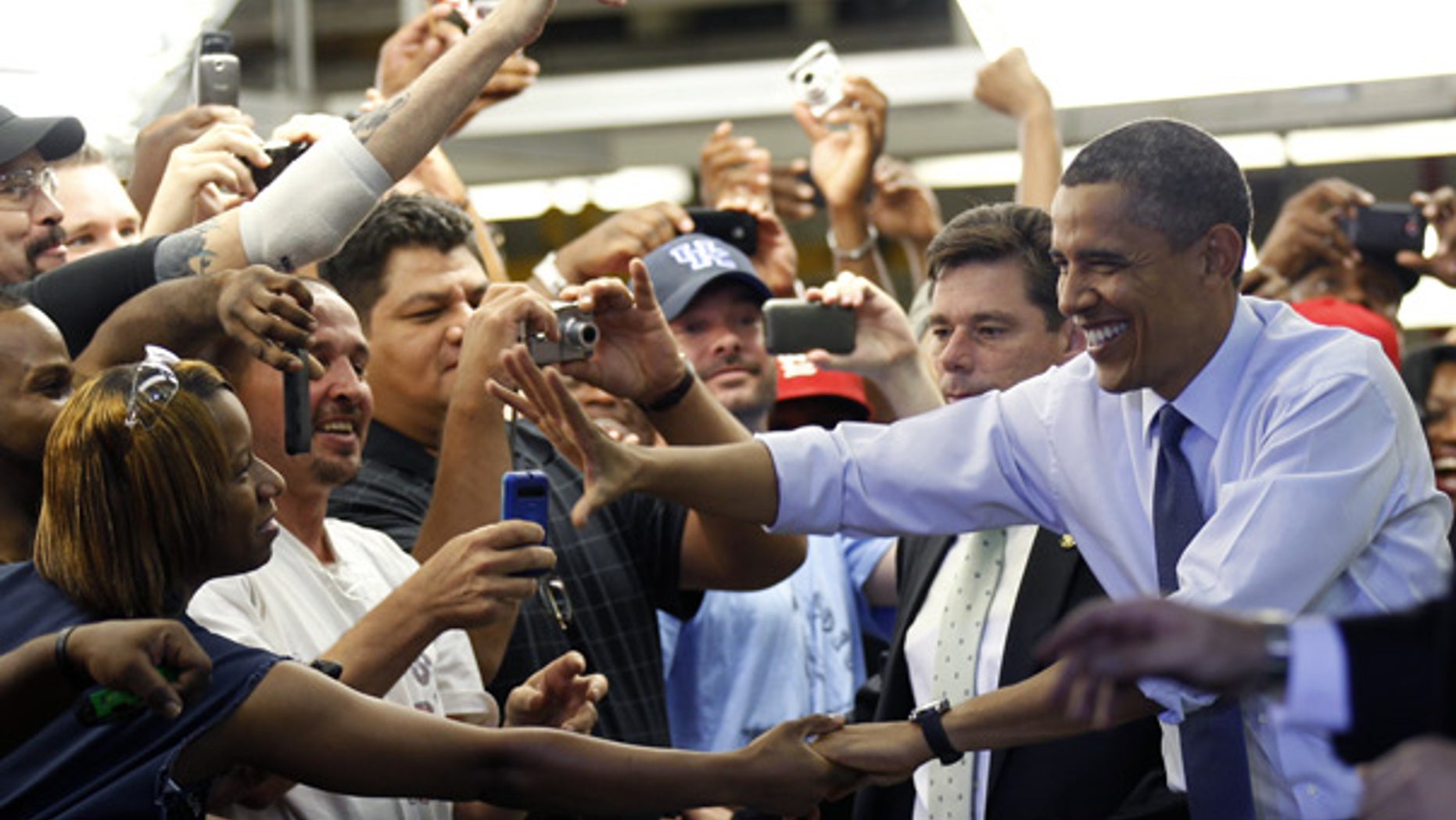 Aug. 5: President Barack Obama greets auto workers at Ford Motor Company Chicago Assembly Plant.