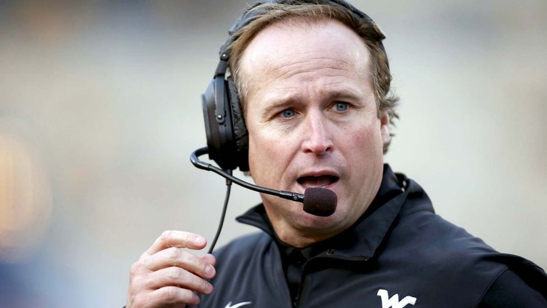 Oct 4, 2014; Morgantown, WV, USA; West Virginia Mountaineers head coach Dana Holgorsen reacts on the sidelines against the Kansas Jayhawks during the third quarter at Milan Puskar Stadium. The Mountaineers won 33-14. Mandatory Credit: Charles LeClaire-USA TODAY Sports