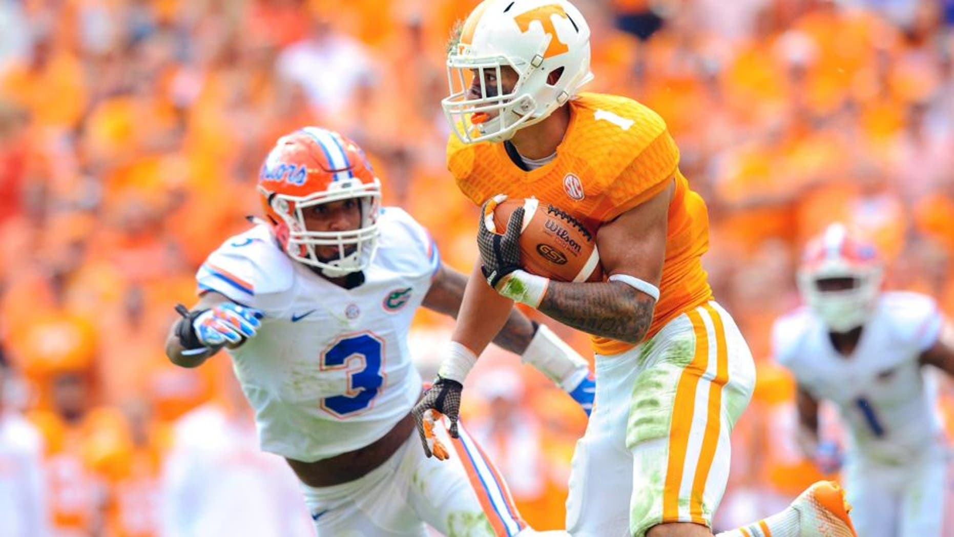 Oct 4, 2014; Knoxville, TN, USA; Tennessee Volunteers running back Jalen Hurd (1) runs the ball against the Florida Gators during the second quarter at Neyland Stadium. Mandatory Credit: Randy Sartin-USA TODAY Sports