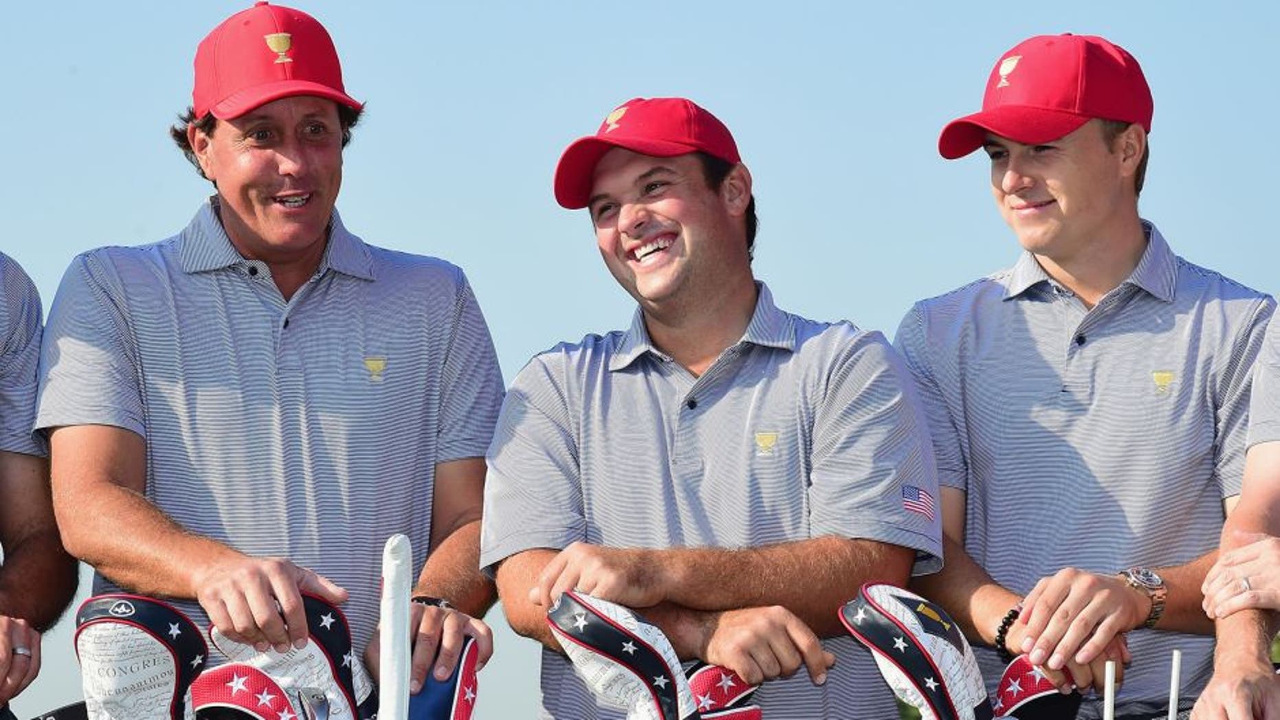INCHEON CITY, SOUTH KOREA - OCTOBER 06: (L-R) Phil Mickelson, Patrick Reed and Jordan Spieth of the United States team pose with the team during a photocall on the practice ground prior to the start of The Presidents Cup at the Jack Nicklaus Golf Club on October 6, 2015 in Incheon City, South Korea. (Photo by Harry How/Getty Images)
