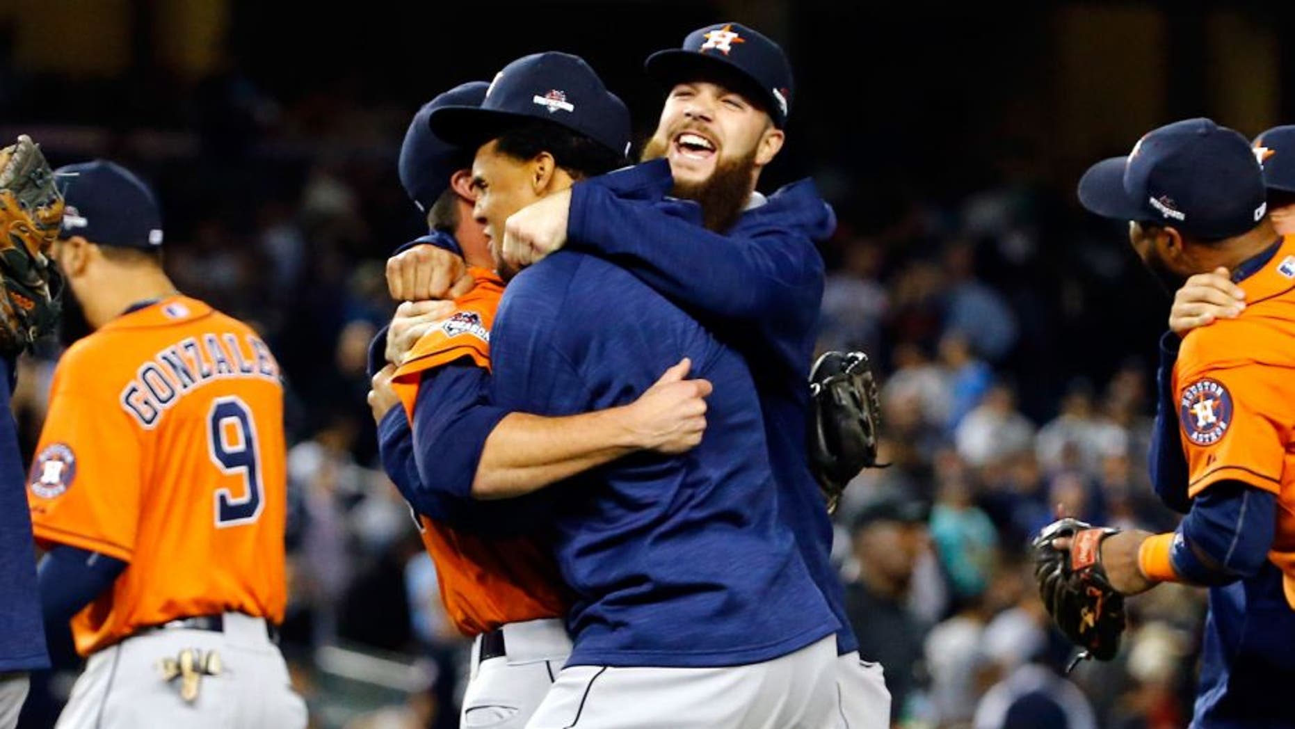 NEW YORK, NY - OCTOBER 06: The Houston Astros celebrate defeating the New York Yankees in the American League Wild Card Game at Yankee Stadium on October 6, 2015 in New York City. The Astros defeated the Yankees with a score of 3 to 0. (Photo by Al Bello/Getty Images)