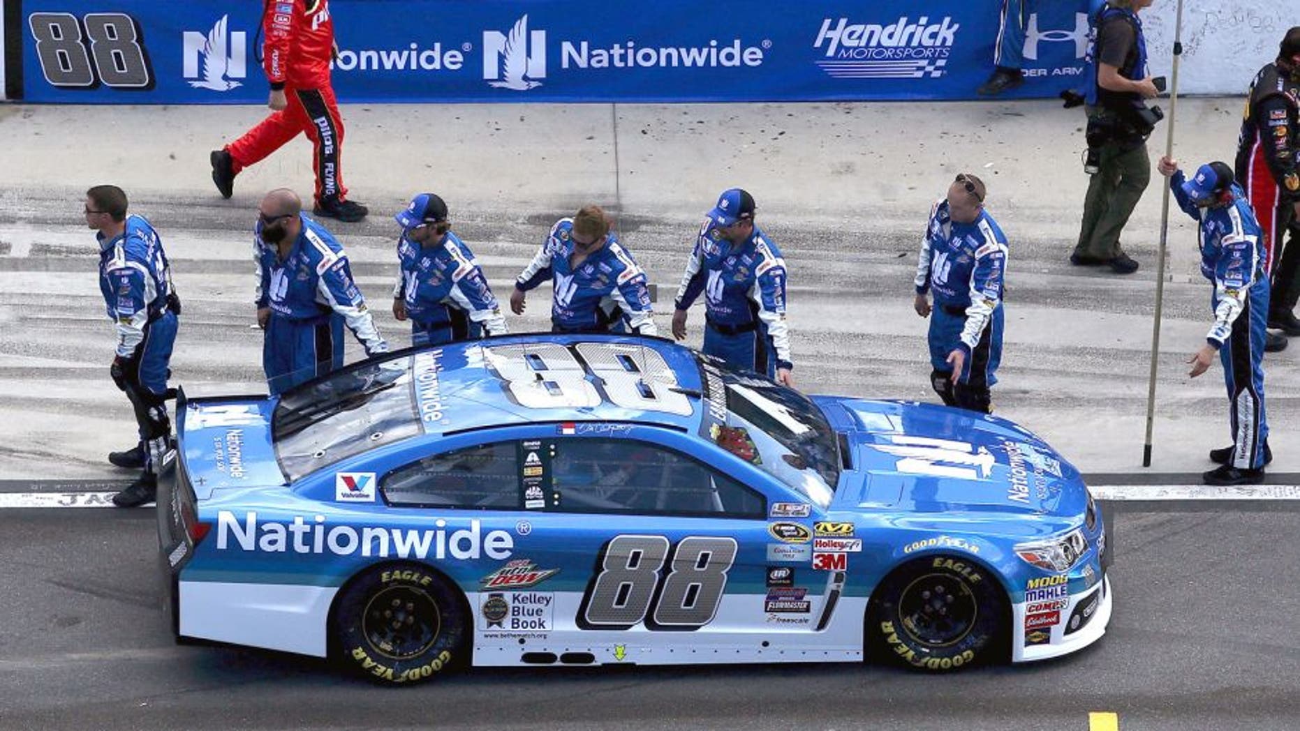 Dale Earnhardt Jr., driver of the #88 Nationwide Chevrolet, high-fives his crew on pit lane prior to the NASCAR Sprint Cup Series 57th Annual Daytona 500 at Daytona International Speedway on February 22, 2015 in Daytona Beach, Florida. (Photo by Sean Gardner/Getty Images)