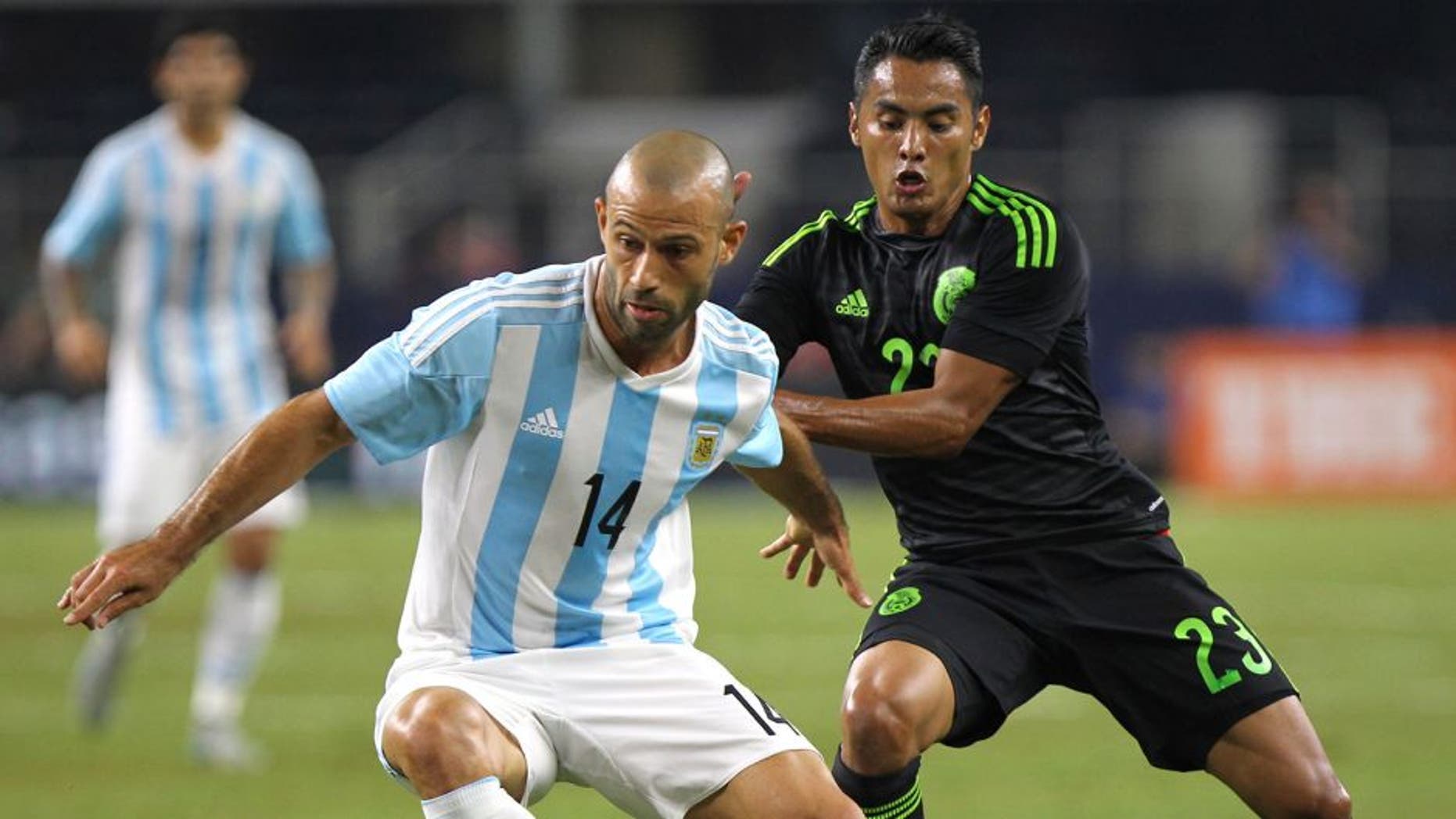ARLINGTON, UNITED STATES - SEPTEMBER 08: Javier Mascherano of Argentina controls the ball as José Juan Vázquez defends during a friendly match between Argentina and Mexico at AT&T Stadium on September 08, 2015 in Arlington, United States. (Photo by Omar Vega/LatinContent/Getty Images)