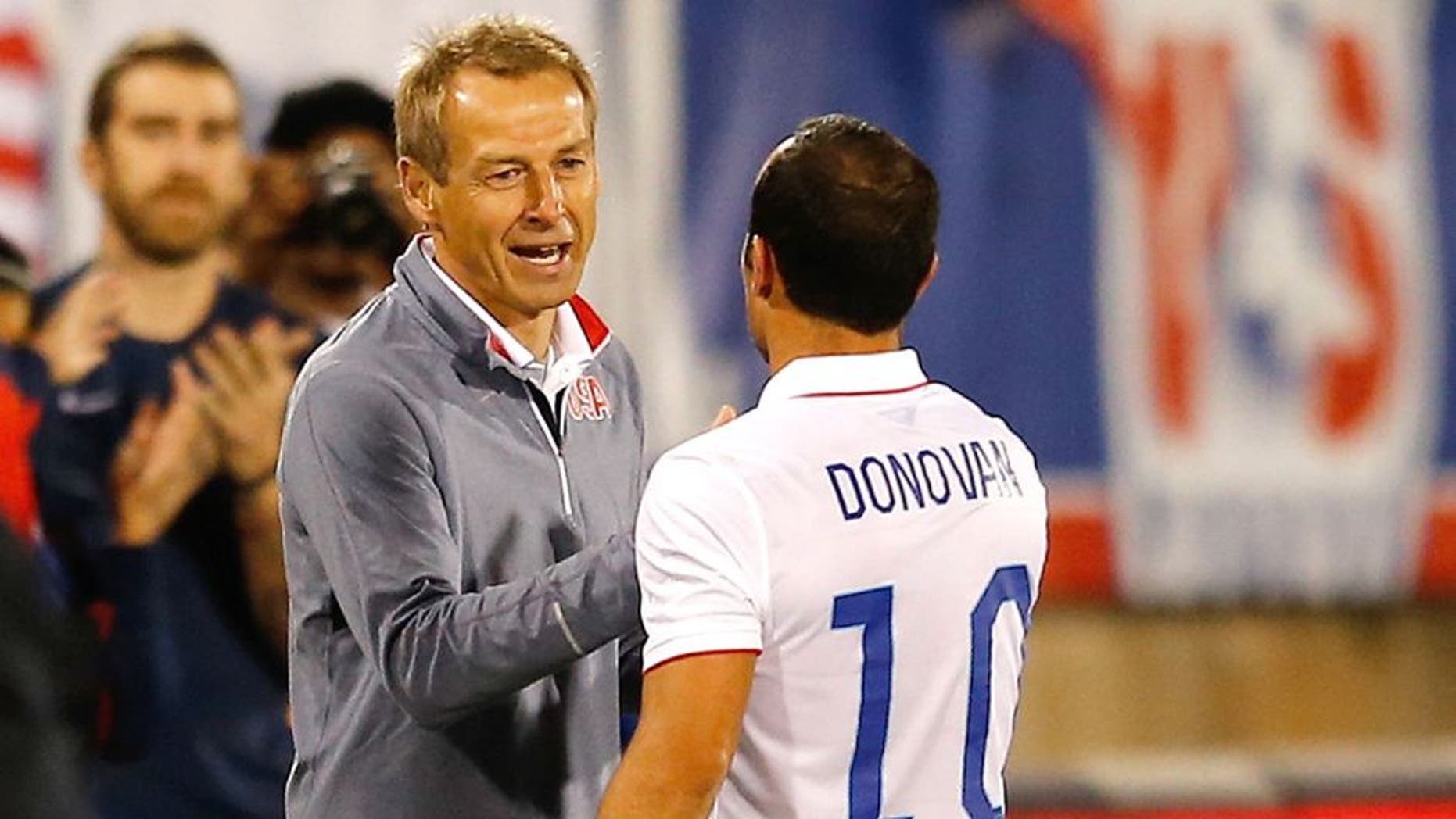 EAST HARTFORD, CT- OCTOBER 10: Landon Donovan #10 of the United States shakes hands head coach Jurgen Klinsmann as he leaves the field after playing in the first half during an international friendly with Ecuador at Rentschler Field on October 10, 2014 in East Hartford, Connecticut. (Photo by Jim Rogash/Getty Images)