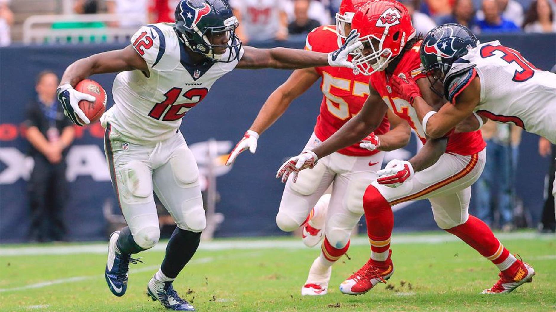 Sep 13, 2015; Houston, TX, USA; Houston Texans wide receiver Keith Mumphery (12) stiff arms Kansas City Chiefs wide receiver Chris Conley (17) during the game at NRG Stadium. Mandatory Credit: Kevin Jairaj-USA TODAY Sports