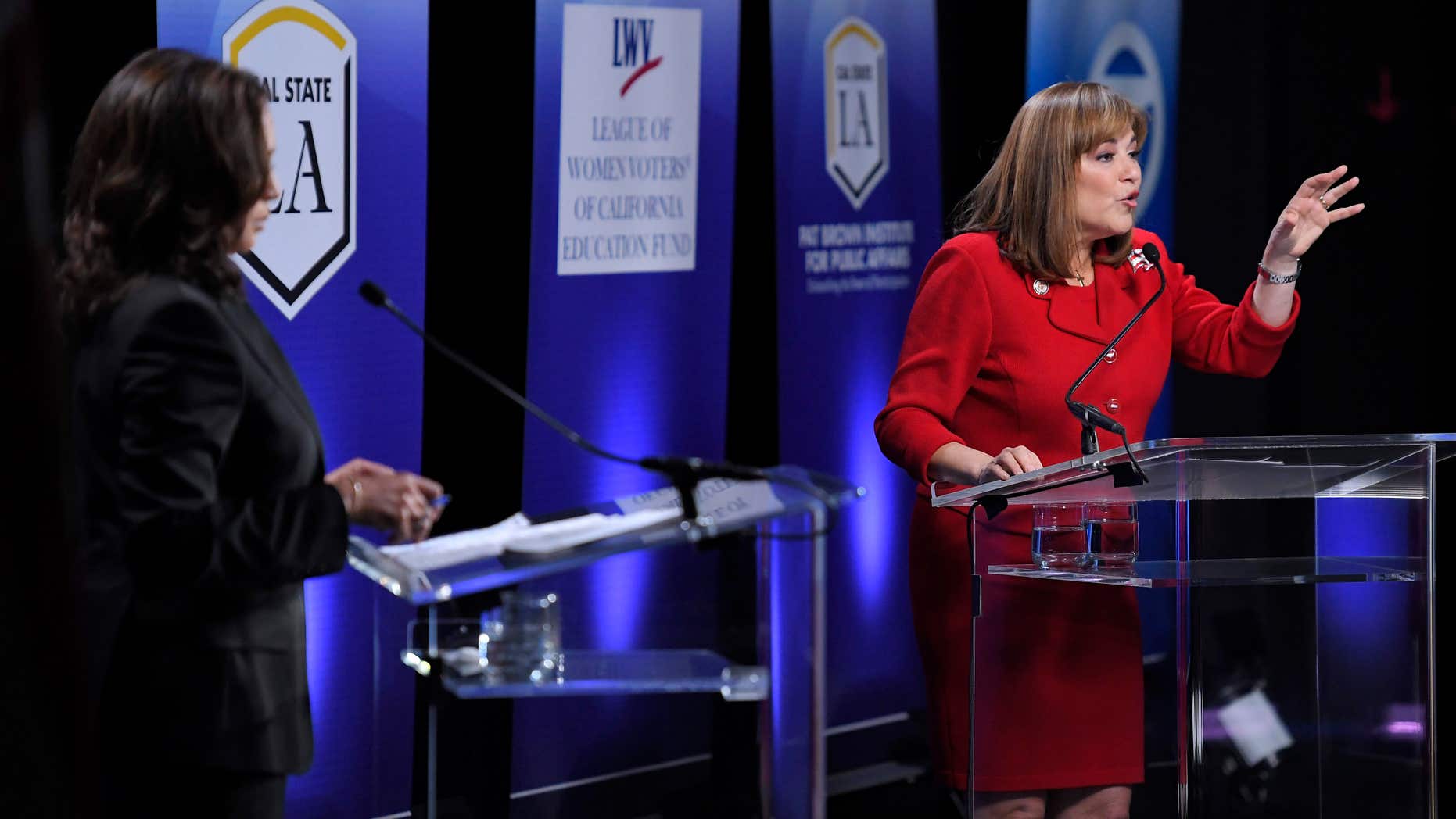 California U.S. Senate Democratic candidate Congresswoman Loretta Sanchez, right, speaks as fellow candidate California Attorney General Kamala Harris listens during a debate, Wednesday, Oct. 5, 2016, in Los Angeles.