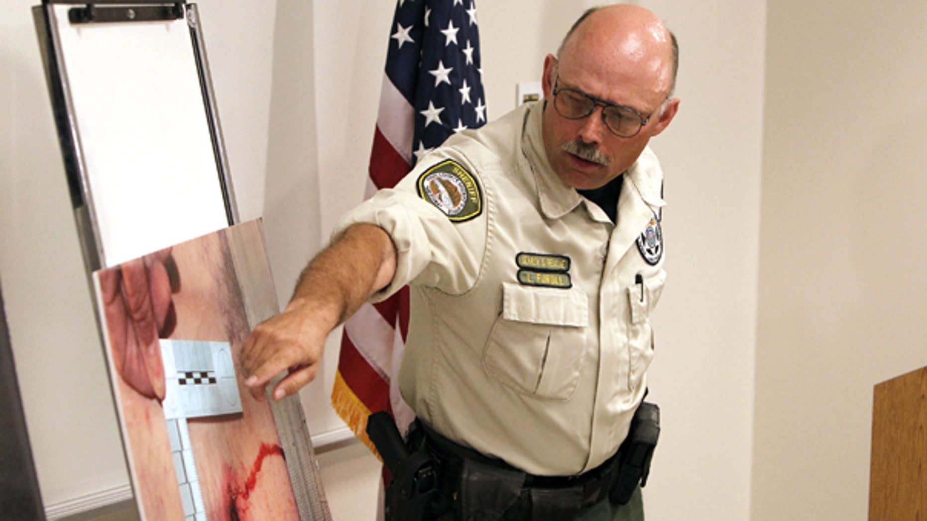 Oct. 7: Deputy Louie Puroll talks about his gunshot wound during a press conference at the Pinal County Sheriff's complex in Florence, AZ.