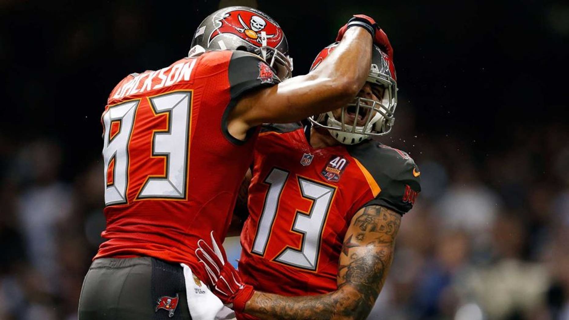 NEW ORLEANS, LA - SEPTEMBER 20: Mike Evans #13 celebrates with Vincent Jackson #83 of the Tampa Bay Buccaneers following his touchdown reception during the second quarter of a game against the New Orleans Saints at the Mercedes-Benz Superdome on September 20, 2015 in New Orleans, Louisiana. (Photo by Wesley Hitt/Getty Images)