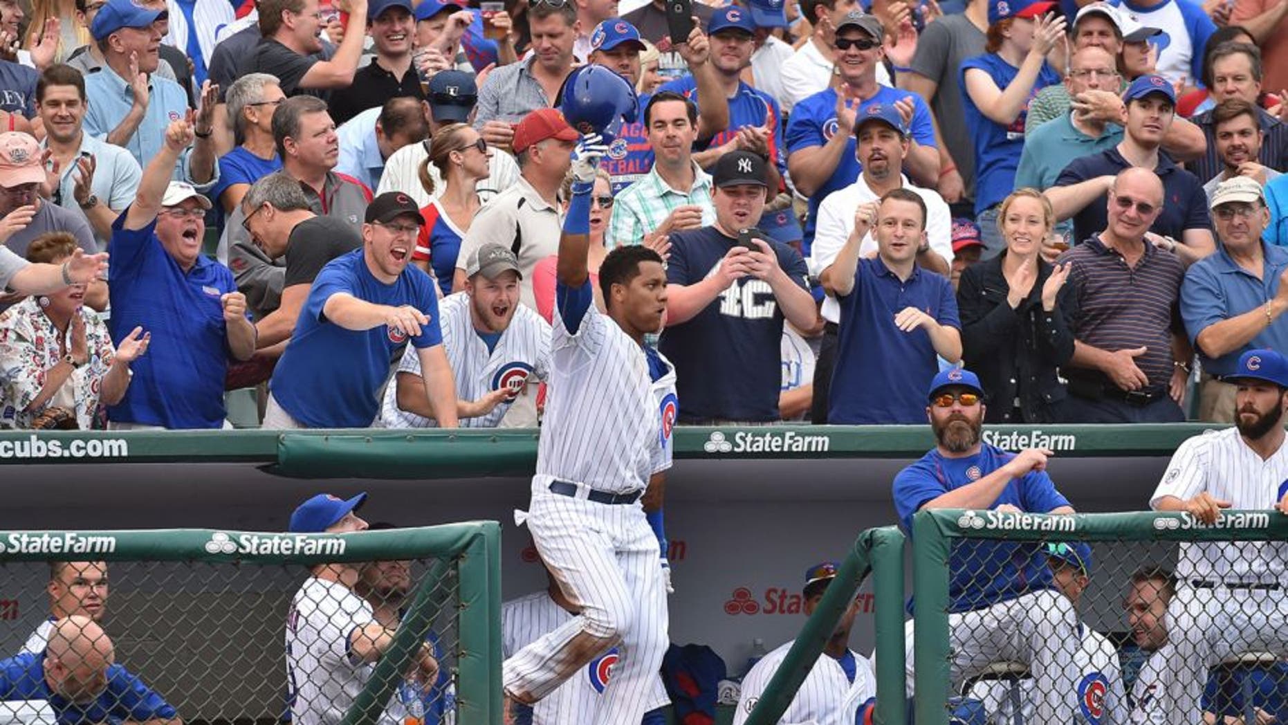 Sep 19, 2015; Chicago, IL, USA; Chicago Cubs shortstop Starlin Castro (13) waives to the fans after hitting his second home run of the game against the St. Louis Cardinals at Wrigley Field. Mandatory Credit: Jasen Vinlove-USA TODAY Sports