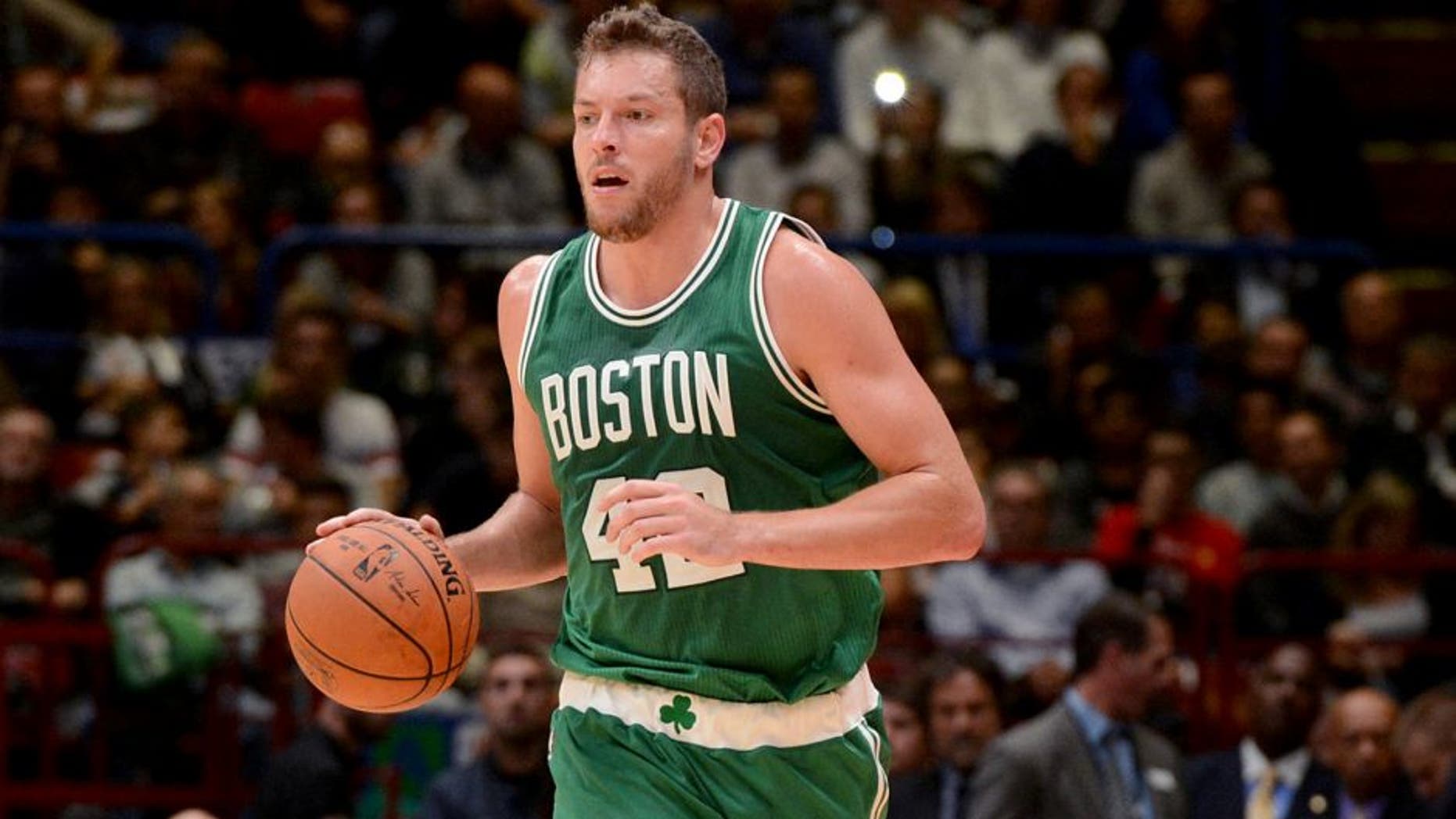 MILAN - OCTOBER 6: David Lee #42 of the Boston Celtics dribbles against Emporio Armani Milano as part of the 2015 Global Games on October 6, 2015 at the Mediolanum Forum, Arena Sala Premium in Milan, Italy. NOTE TO USER: User expressly acknowledges and agrees that, by downloading and or using this photograph, User is consenting to the terms and conditions of the Getty Images License Agreement. Mandatory Copyright Notice: Copyright 2015 NBAE (Photo by Garrett Ellwood/NBAE via Getty Images)