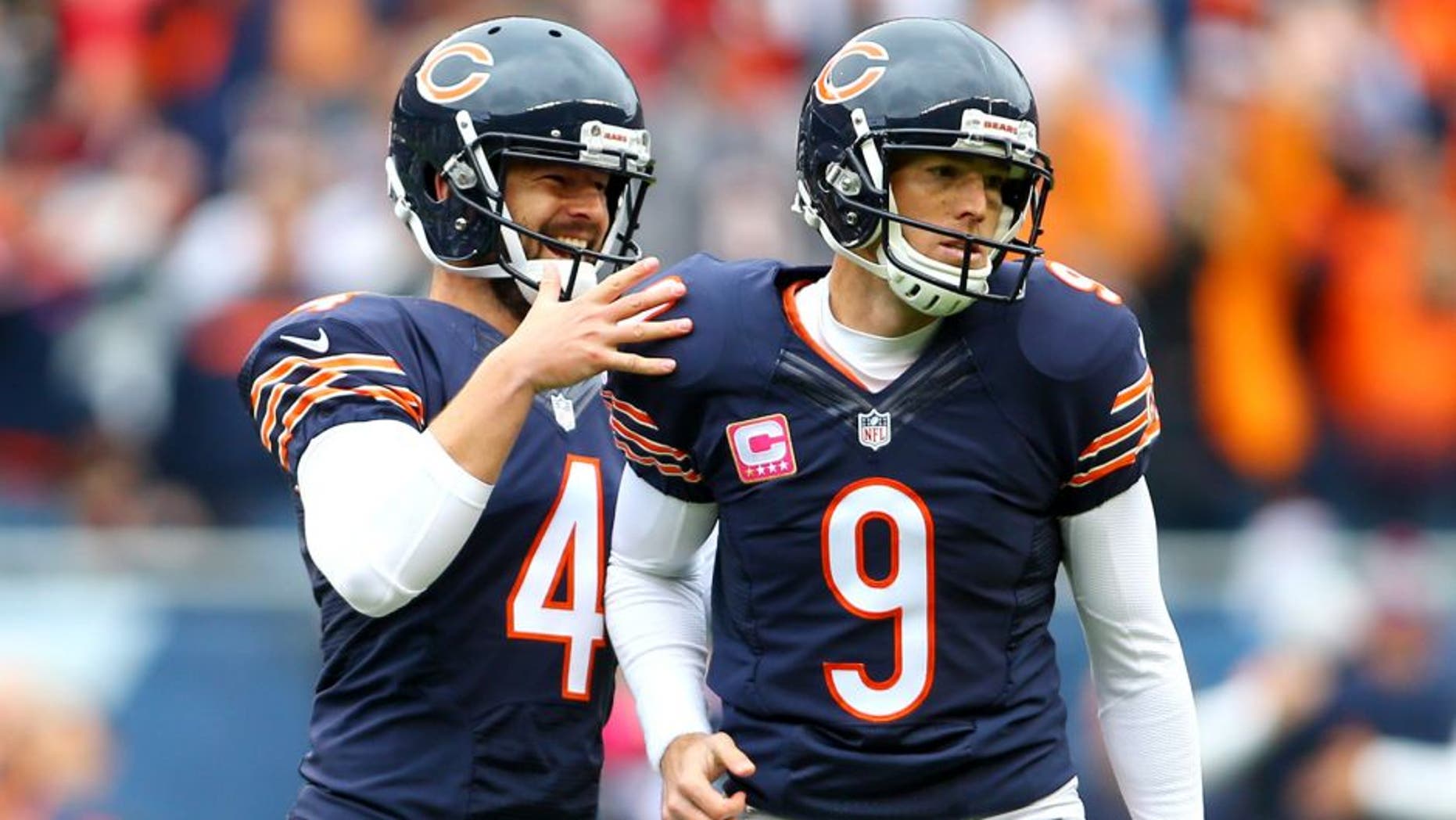 Oct 4, 2015; Chicago, IL, USA; Chicago Bears kicker Robbie Gould (9) celebrates with punter Spencer Lanning (4) ater kicking the winning field goal against the Oakland Raiders in the fourth quarter at Soldier Field. Mandatory Credit: Jerry Lai-USA TODAY Sports