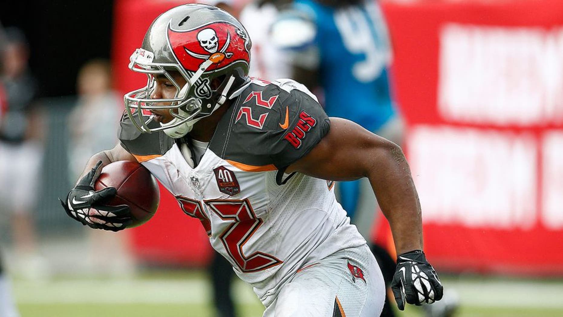 Oct 4, 2015; Tampa, FL, USA; Tampa Bay Buccaneers running back Doug Martin (22) runs for a first down during the fourth quarter of an NFL football game against the Carolina Panthers at Raymond James Stadium. Carolina won 37-23. Mandatory Credit: Reinhold Matay-USA TODAY Sports