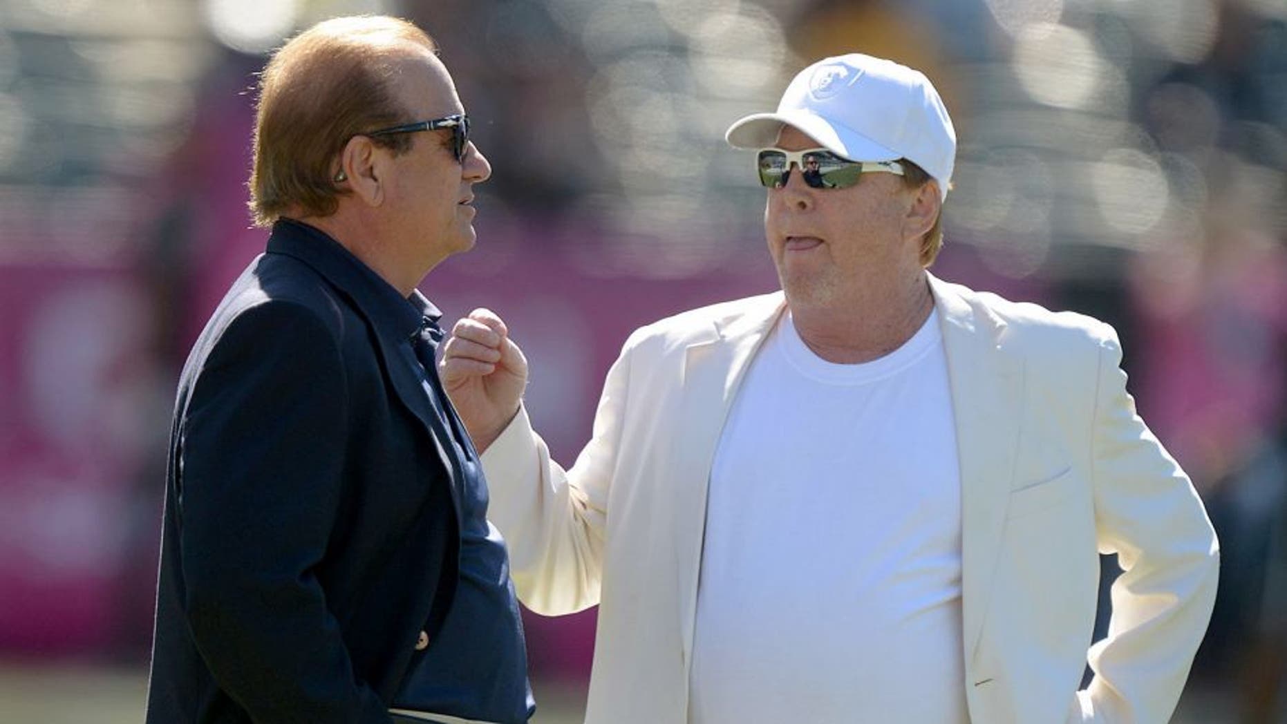 Oct 12, 2014; Oakland, CA, USA; San Diego Chargers president Dean Spanos (left) and Oakland Raiders owner Mark Davis before the game at O.co Coliseum. Mandatory Credit: Kirby Lee-USA TODAY Sports