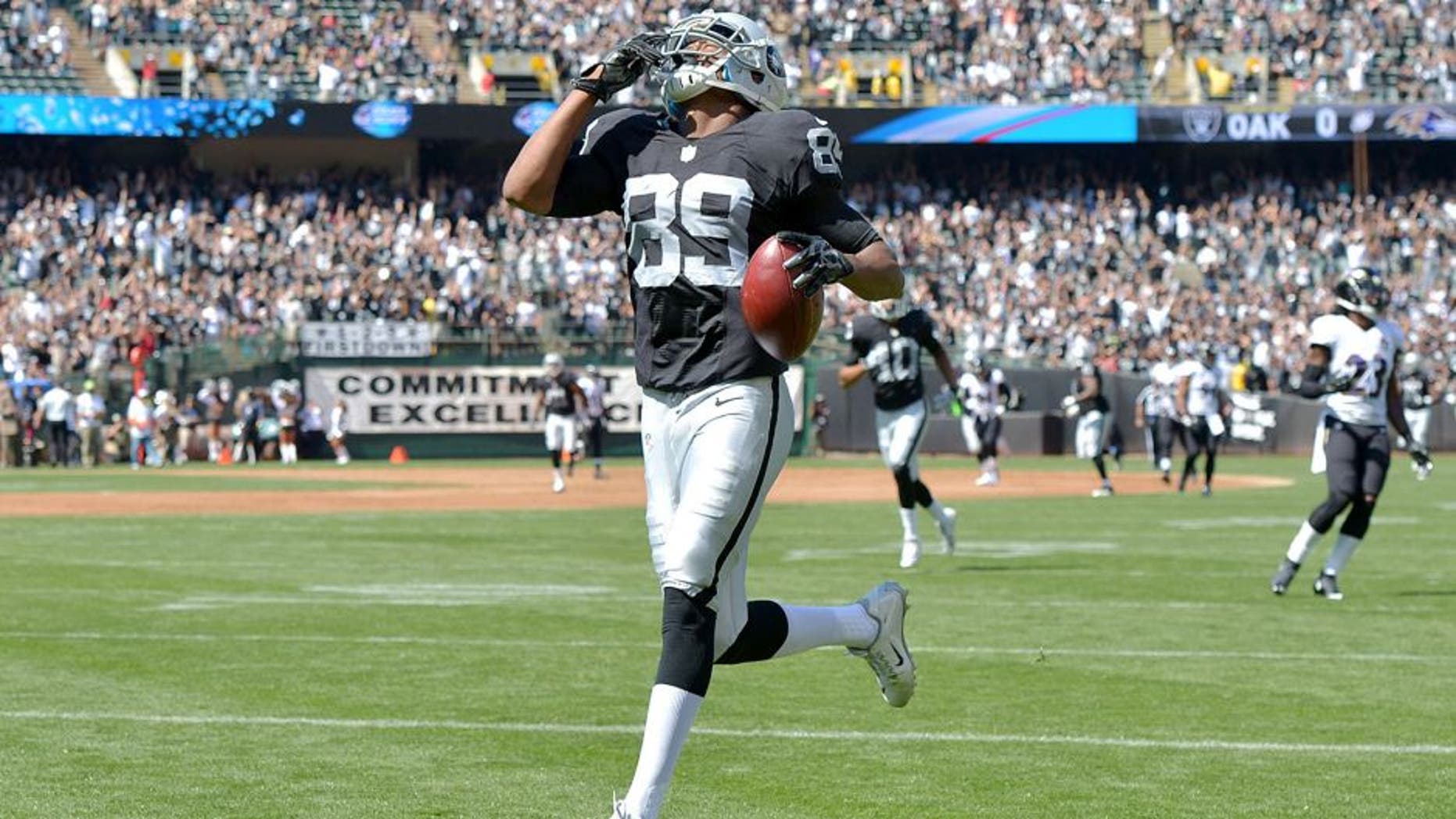 Sep 20, 2015; Oakland, CA, USA; Oakland Raiders receiver Amari Cooper (89) reacts after scoring on a 68-yard touchdown reception in the first quarter against the Baltimore Ravens as at O.co Coliseum. Mandatory Credit: Kirby Lee-USA TODAY Sports