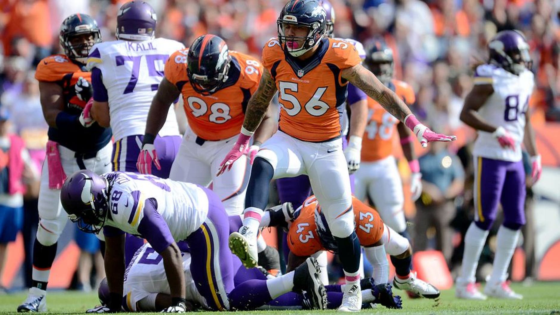 Oct 4, 2015; Denver, CO, USA; Denver Broncos linebacker Shane Ray (56) celebrates his sack in the first quarter against the Minnesota Vikings at Sports Authority Field at Mile High. Mandatory Credit: Ron Chenoy-USA TODAY Sports