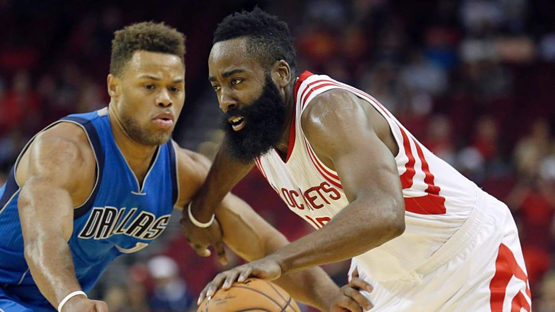 Oct 7, 2015; Houston, TX, USA; Houston Rockets guard James Harden (13) dribbles against Dallas Mavericks guard Justin Anderson (1) in the first quarter at Toyota Center. Mandatory Credit: Thomas B. Shea-USA TODAY Sports