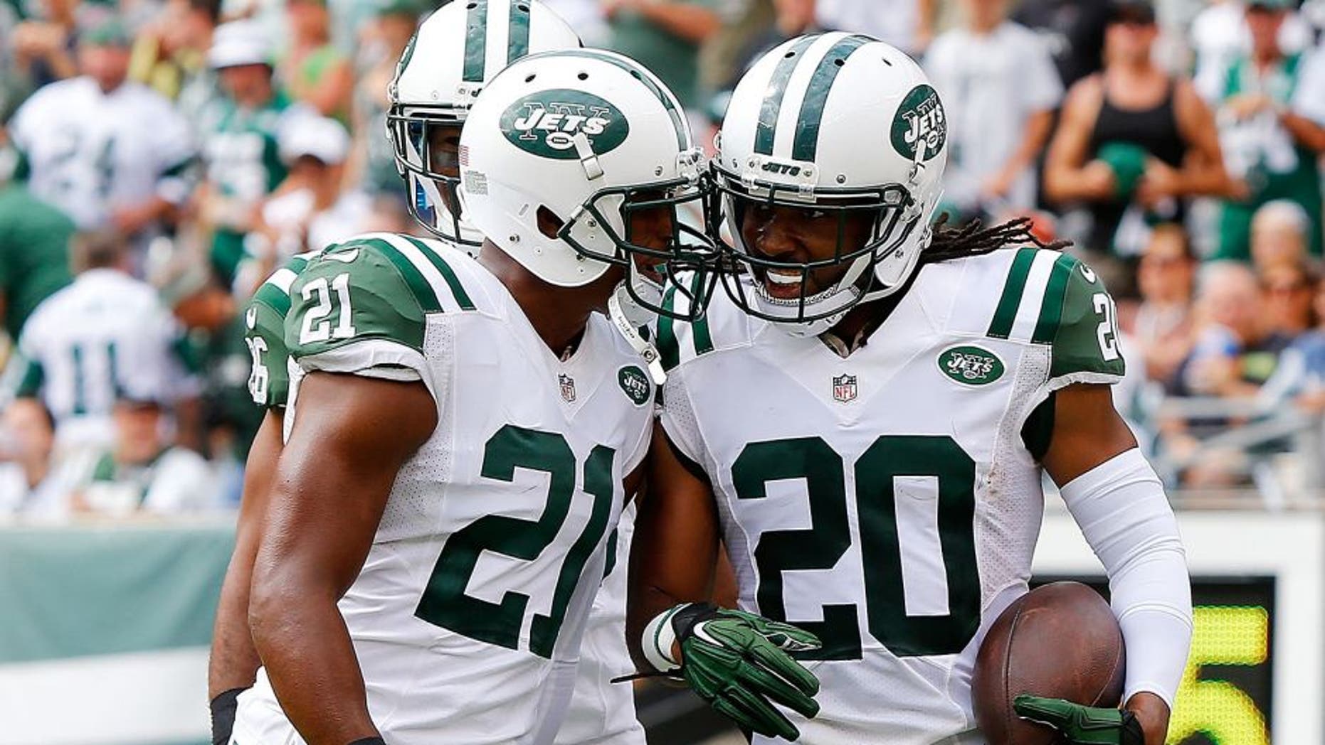 EAST RUTHERFORD, NJ - SEPTEMBER 13: (NEW YORK DAILIES OUT) Marcus Williams #20 of the New York Jets celebrates his interception against the Cleveland Browns with his teammate Marcus Gilchrist #21 on September 13, 2015 at MetLife Stadium in East Rutherford, New Jersey. The Jets defeated the Browns 31-10. (Photo by Jim McIsaac/Getty Images)