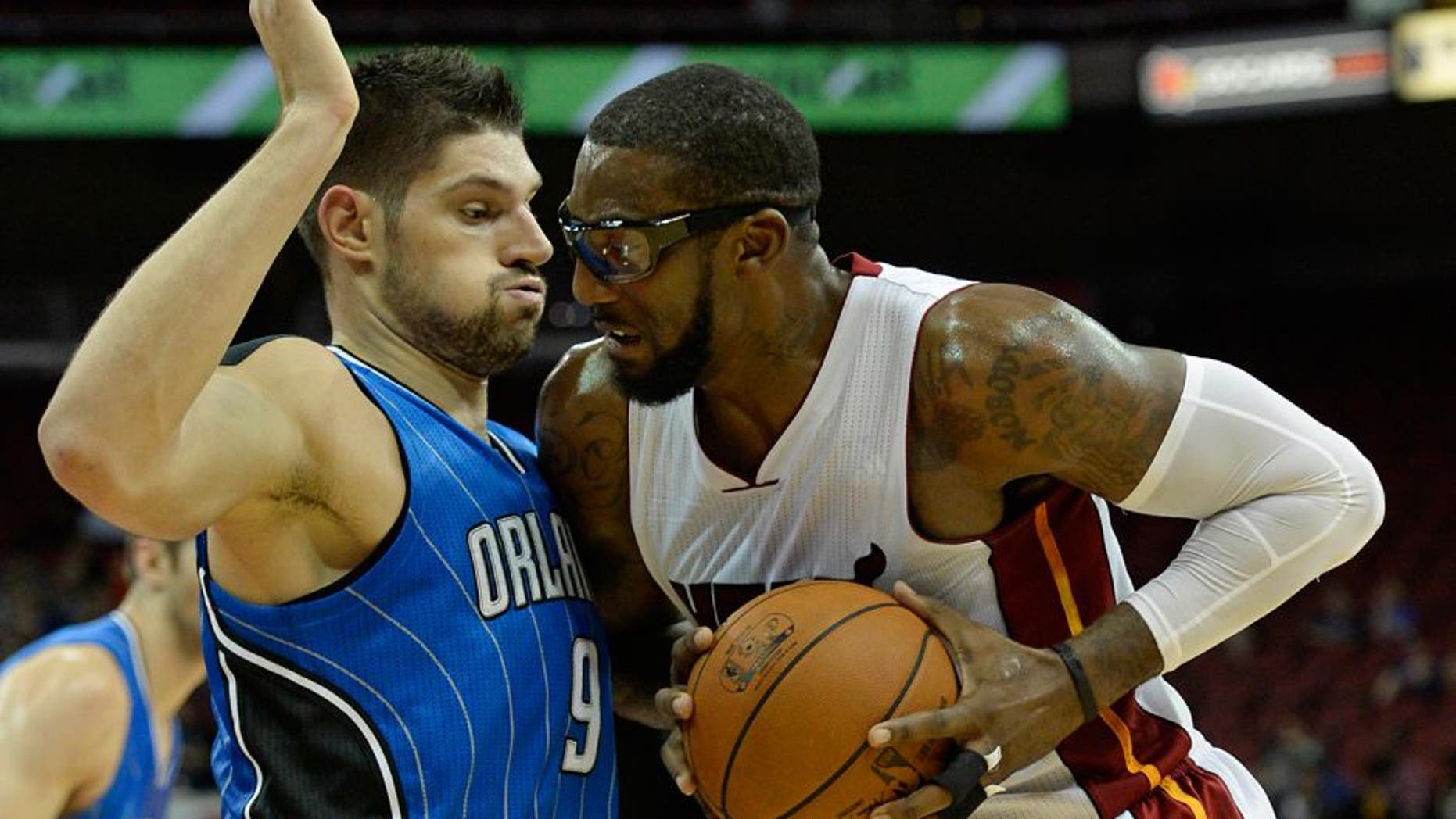 Oct 7, 2015; Louisville, KY, USA; Miami Heat forward Amar'e Stoudemire (5) posts up against Orlando Magic center Nikola Vucevic (9) during the second quarter at KFC Yum! Center. Mandatory Credit: Jamie Rhodes-USA TODAY Sports