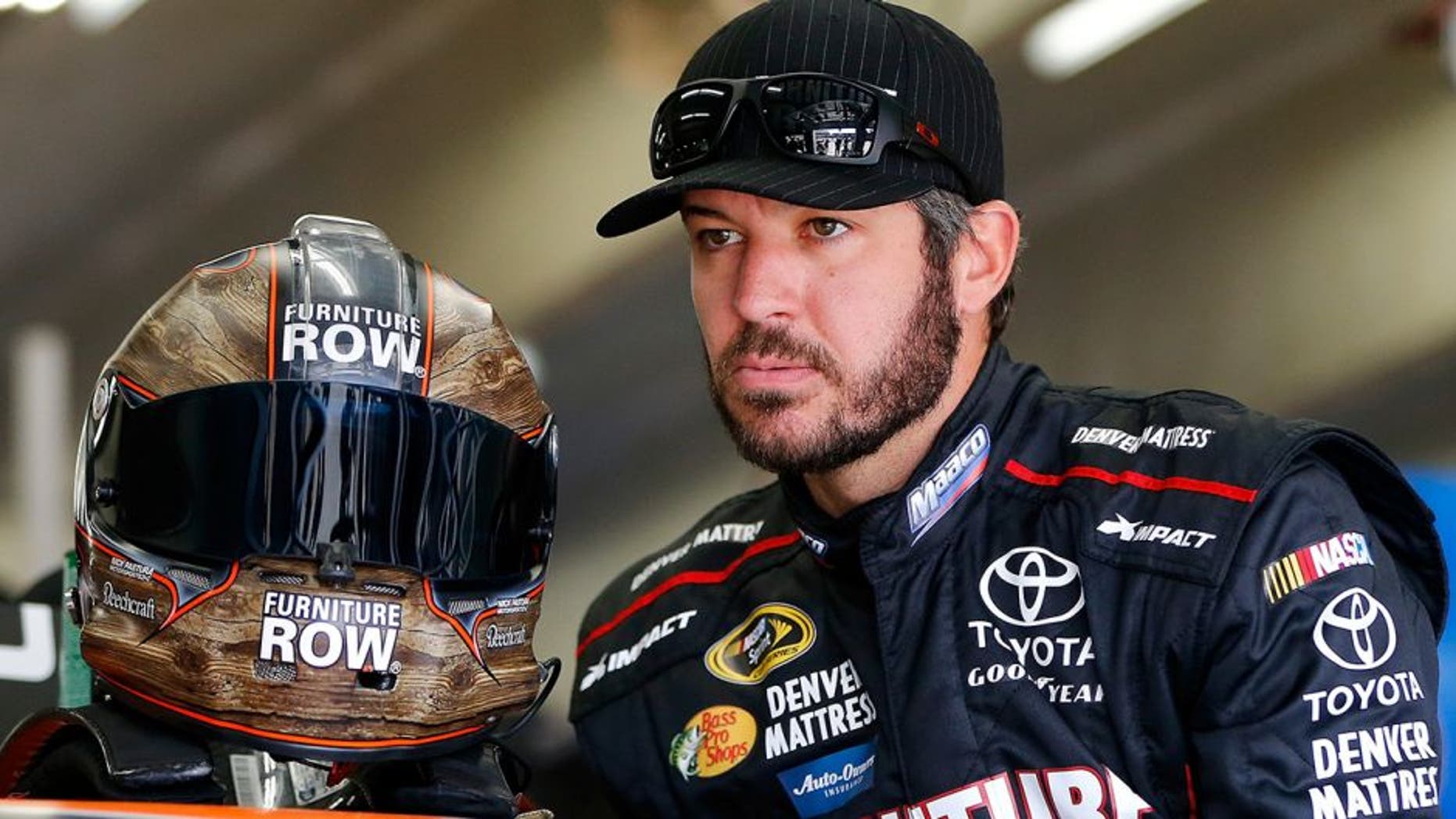 CHARLOTTE, NC - OCTOBER 06: Martin Truex Jr, driver of the #78 Furniture Row/Denver Mattress Toyota, prepares to drive during practice for the NASCAR Sprint Cup Series Bank of America 500 at Charlotte Motor Speedway on October 6, 2016 in Charlotte, North Carolina. (Photo by Jonathan Ferrey/NASCAR via Getty Images)