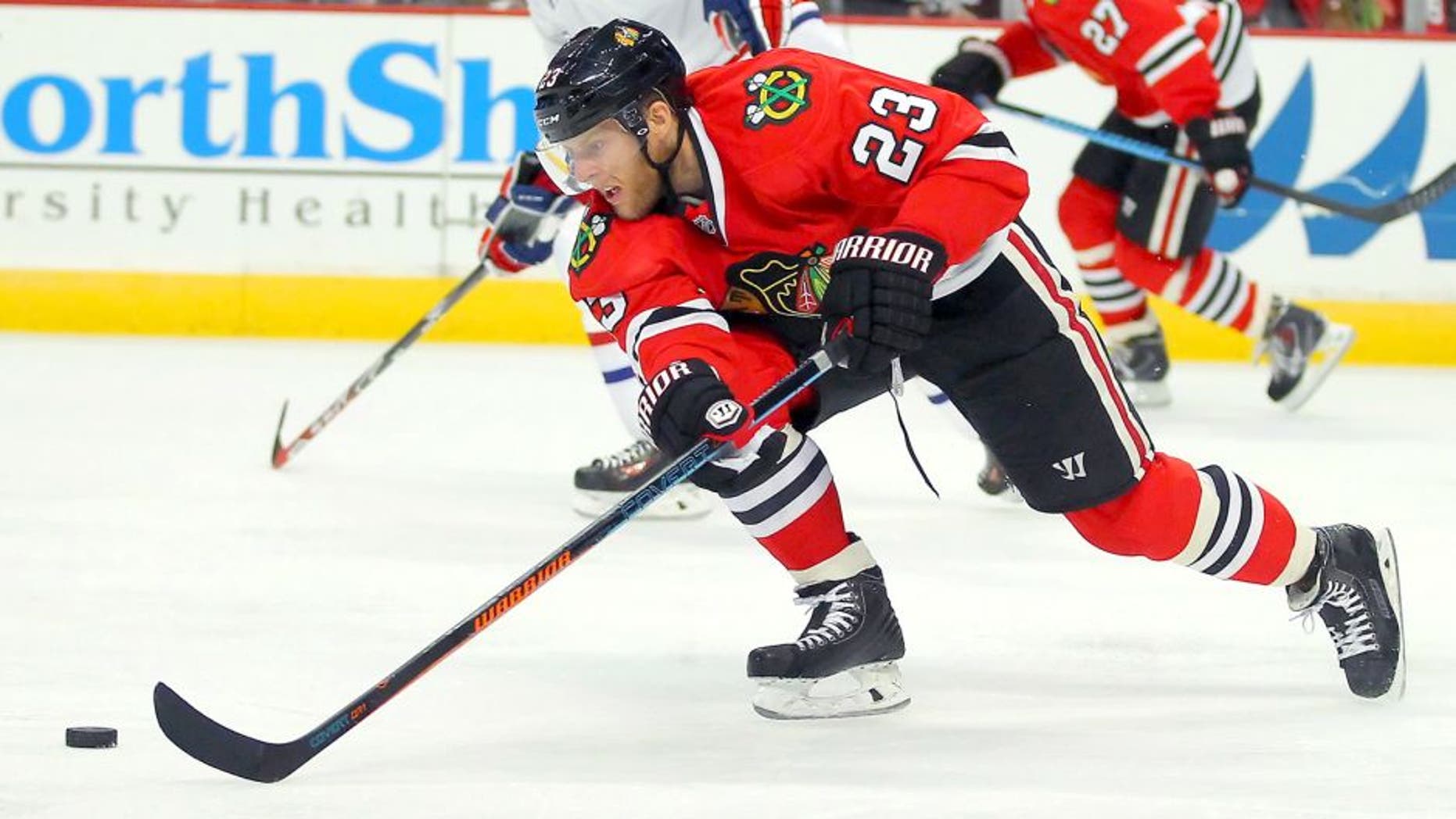 Oct 1, 2014; Chicago, IL, USA; Chicago Blackhawks right wing Kris Versteeg (23) with the puck during the second period against the Montreal Canadiens at the United Center. Mandatory Credit: Dennis Wierzbicki-USA TODAY Sports