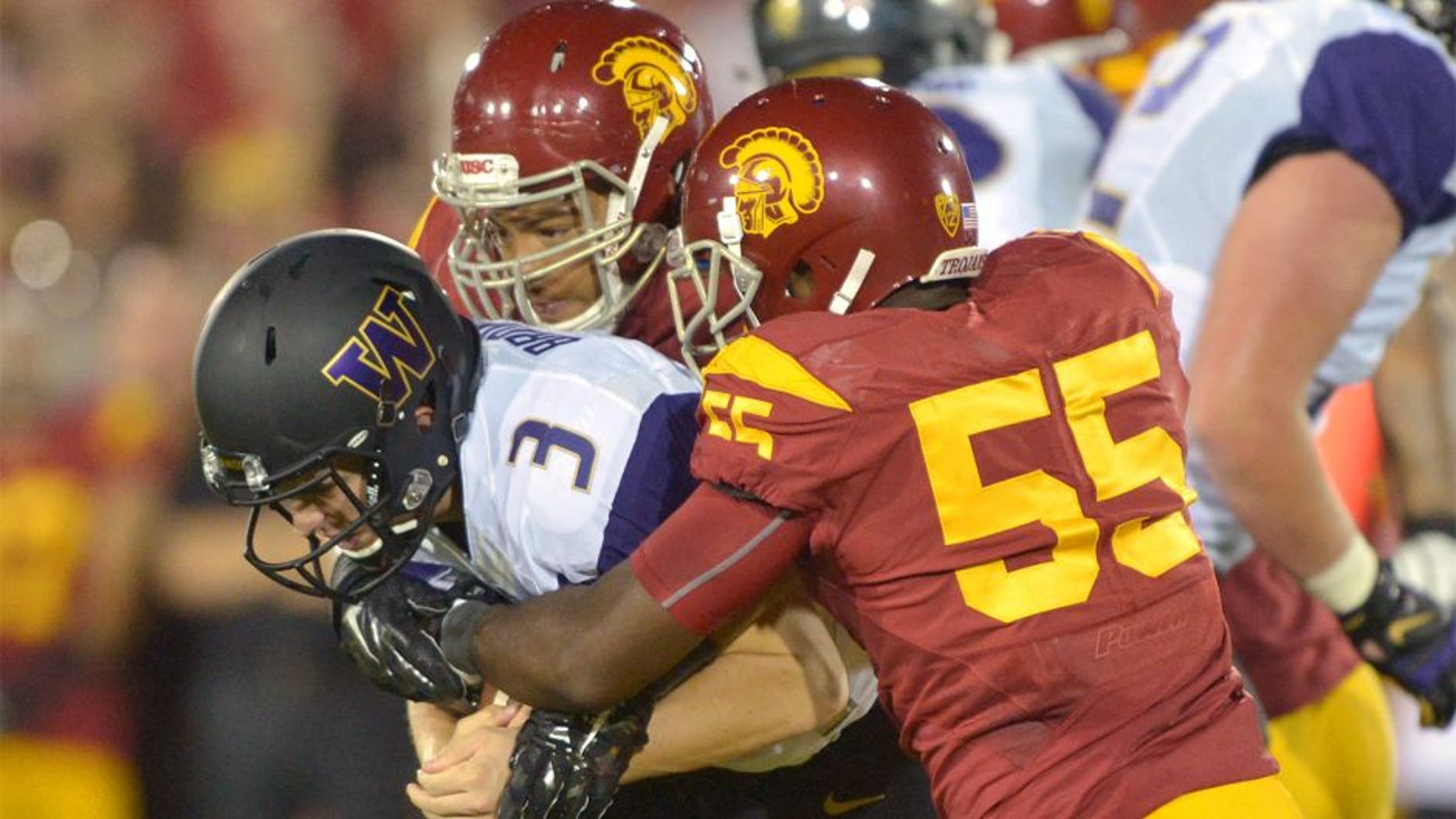 Oct 8, 2015; Los Angeles, CA, USA; Southern California Trojans defensive end Greg Townsend Jr. (93) and linebacker Lamar Dawson (55) sack Washington Huskies quarterback Jake Browning (3) at Los Angeles Memorial Coliseum. Mandatory Credit: Kirby Lee-USA TODAY Sports