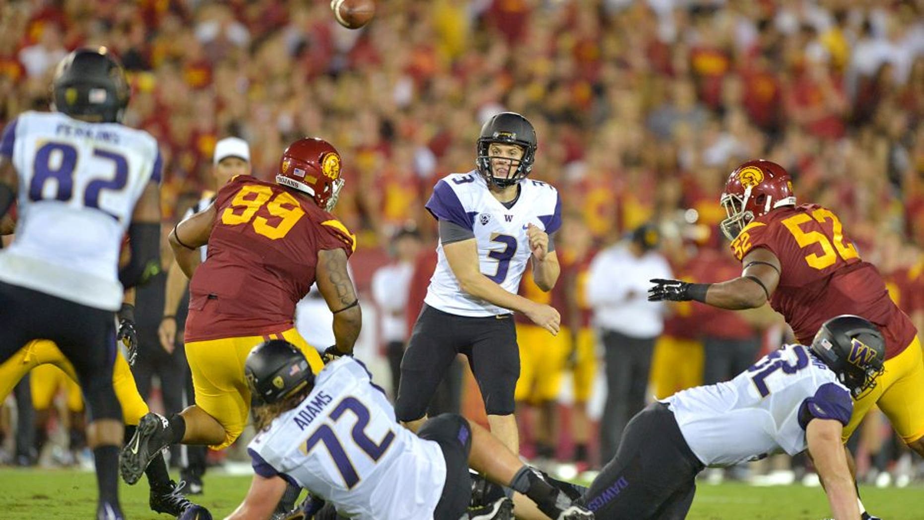 Oct 8, 2015; Los Angeles, CA, USA; Washington Huskies quarterback Jake Browning (3) throws a pass to tight end Joshua Perkins (82) against the Southern California Trojans at Los Angeles Memorial Coliseum. Mandatory Credit: Kirby Lee-USA TODAY Sports