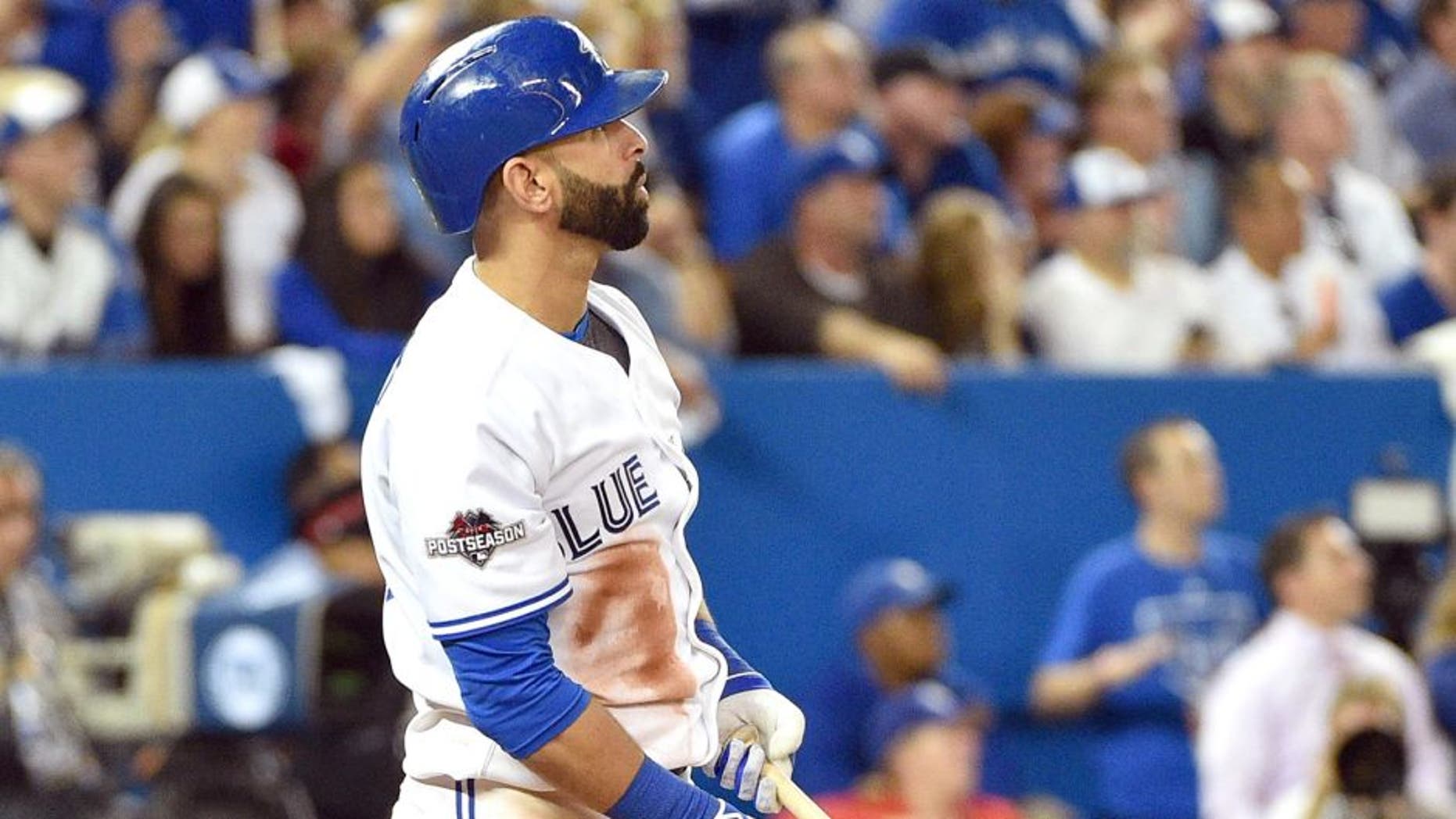 Oct 8, 2015; Toronto, Ontario, CAN; Toronto Blue Jays right fielder Jose Bautista hits a solo home run against the Texas Rangers in the sixth inning in game one of the ALDS at Rogers Centre. Mandatory Credit: Nick Turchiaro-USA TODAY Sports
