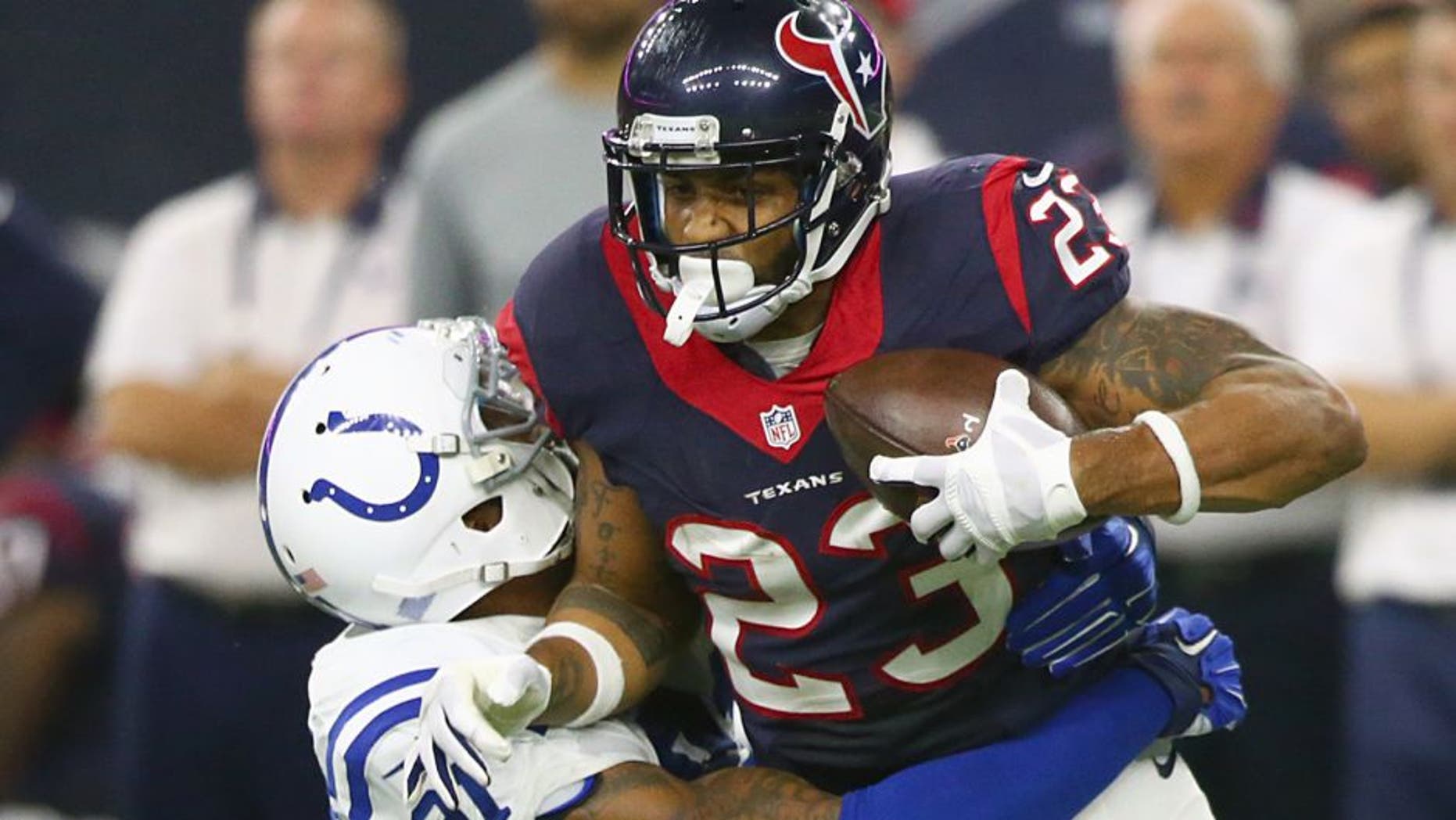 HOUSTON, TX - OCTOBER 08: Arian Foster #23 of the Houston Texans is tackled by Jonathan Newsome #91 of the Indianapolis Colts in the first quarter on October 8, 2015 at NRG Stadium in Houston, Texas. (Photo by Ronald Martinez/Getty Images)