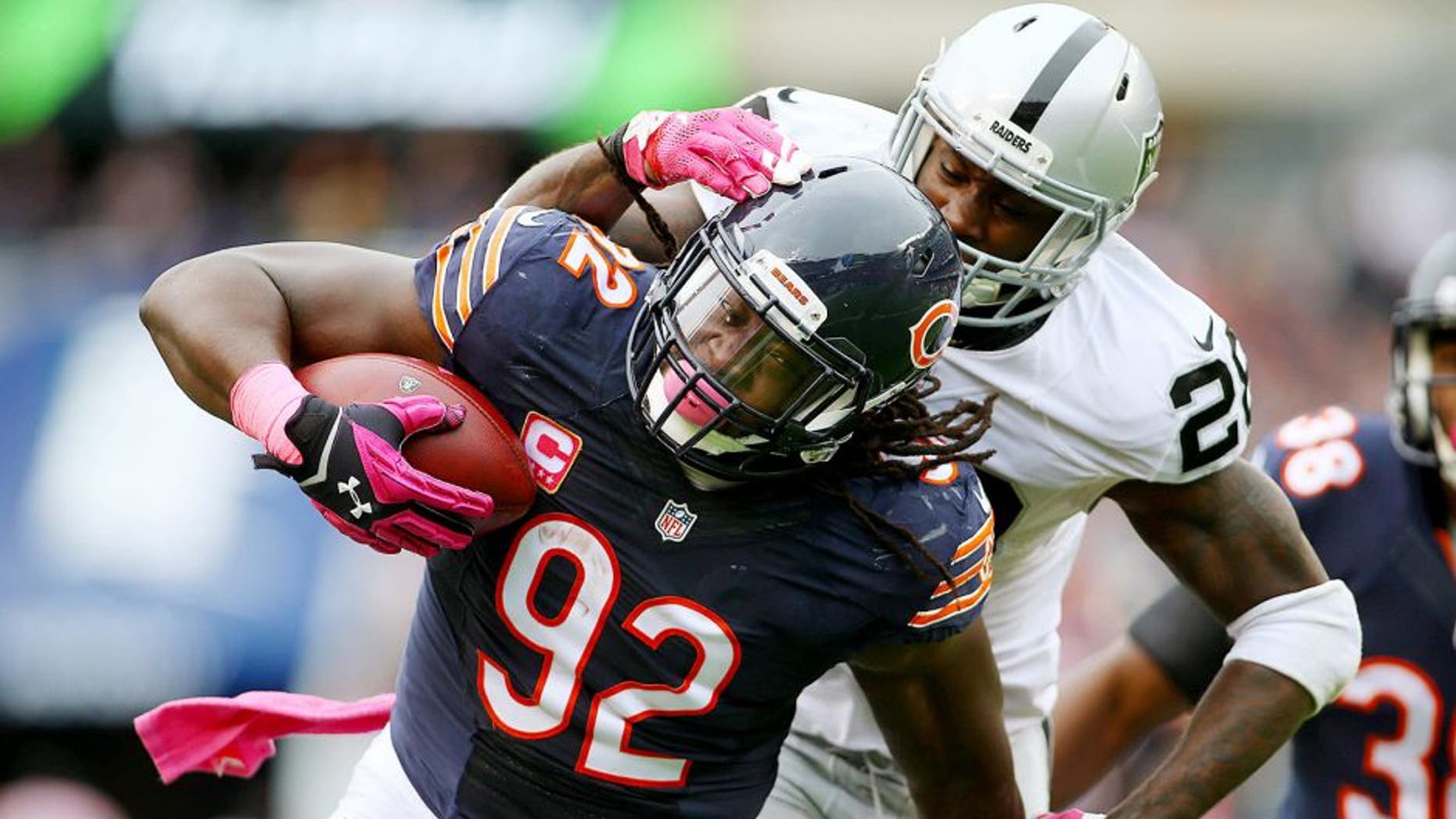 Oct 4, 2015; Chicago, IL, USA; Chicago Bears outside linebacker Pernell McPhee (92) intercepts a pass intended for Oakland Raiders running back Latavius Murray (28) during the second quarter at Soldier Field. Mandatory Credit: Jerry Lai-USA TODAY Sports