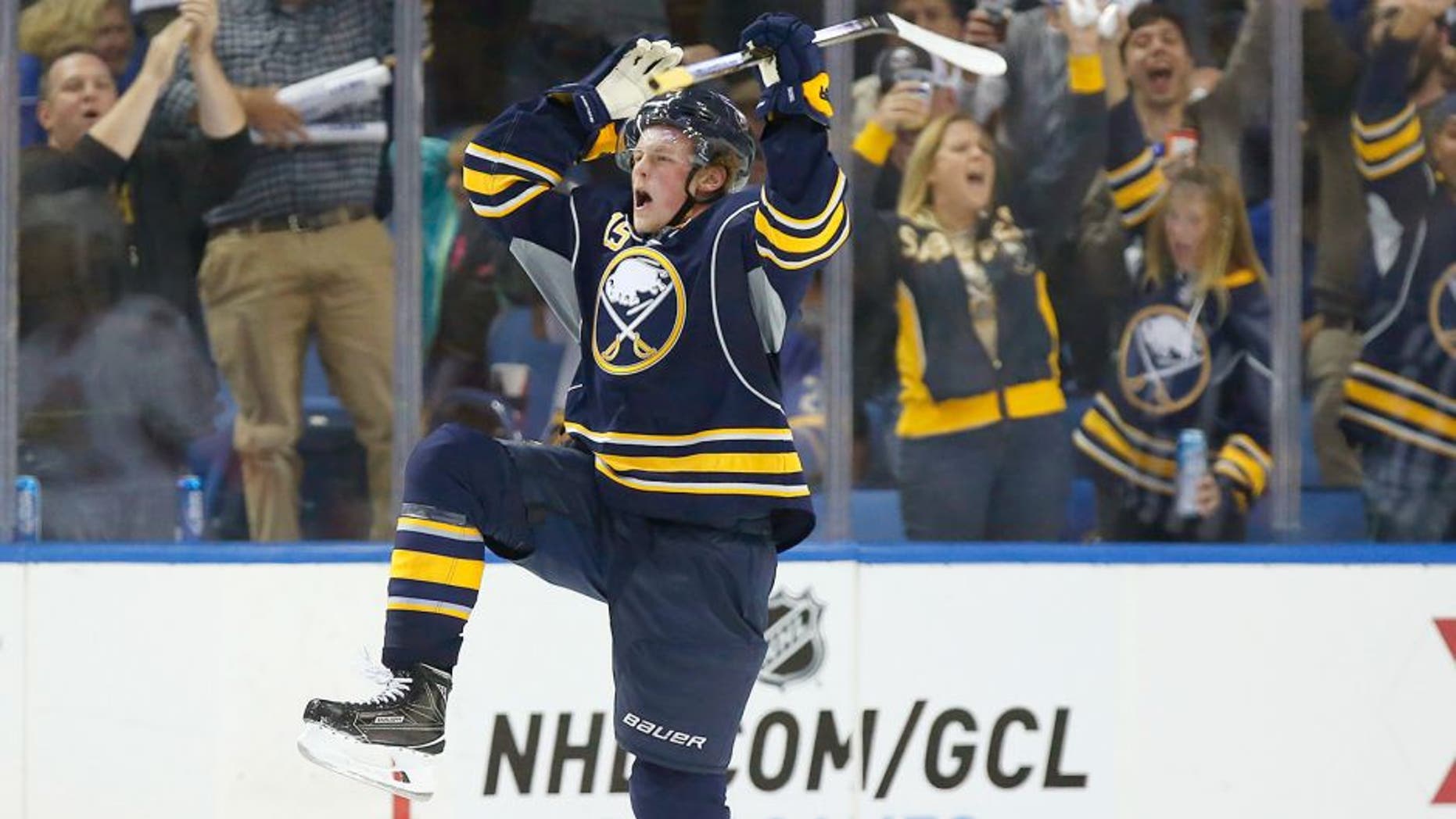 Oct 8, 2015; Buffalo, NY, USA; Buffalo Sabres center Jack Eichel (15) celebrates after scoring his first NHL goal during the third period against the Ottawa Senators at First Niagara Center. Senators beat the Sabres 3-1. Mandatory Credit: Kevin Hoffman-USA TODAY Sports