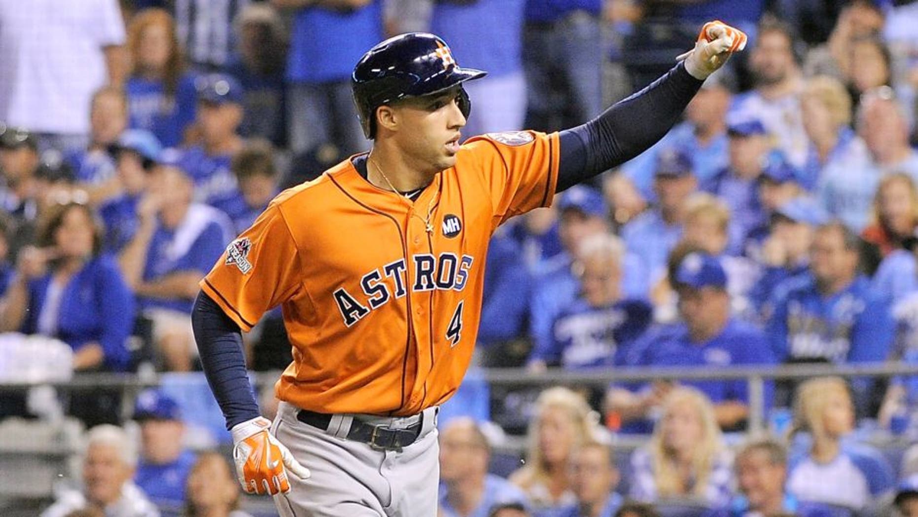 George Springer #4 of the Houston Astros celebrates after hitting a solo home run in the fifth inning against the Kansas City Royals during game one of the American League Division Series at Kauffman Stadium on October 8, 2015 in Kansas City, Missouri. (Photo by Ed Zurga/Getty Images)