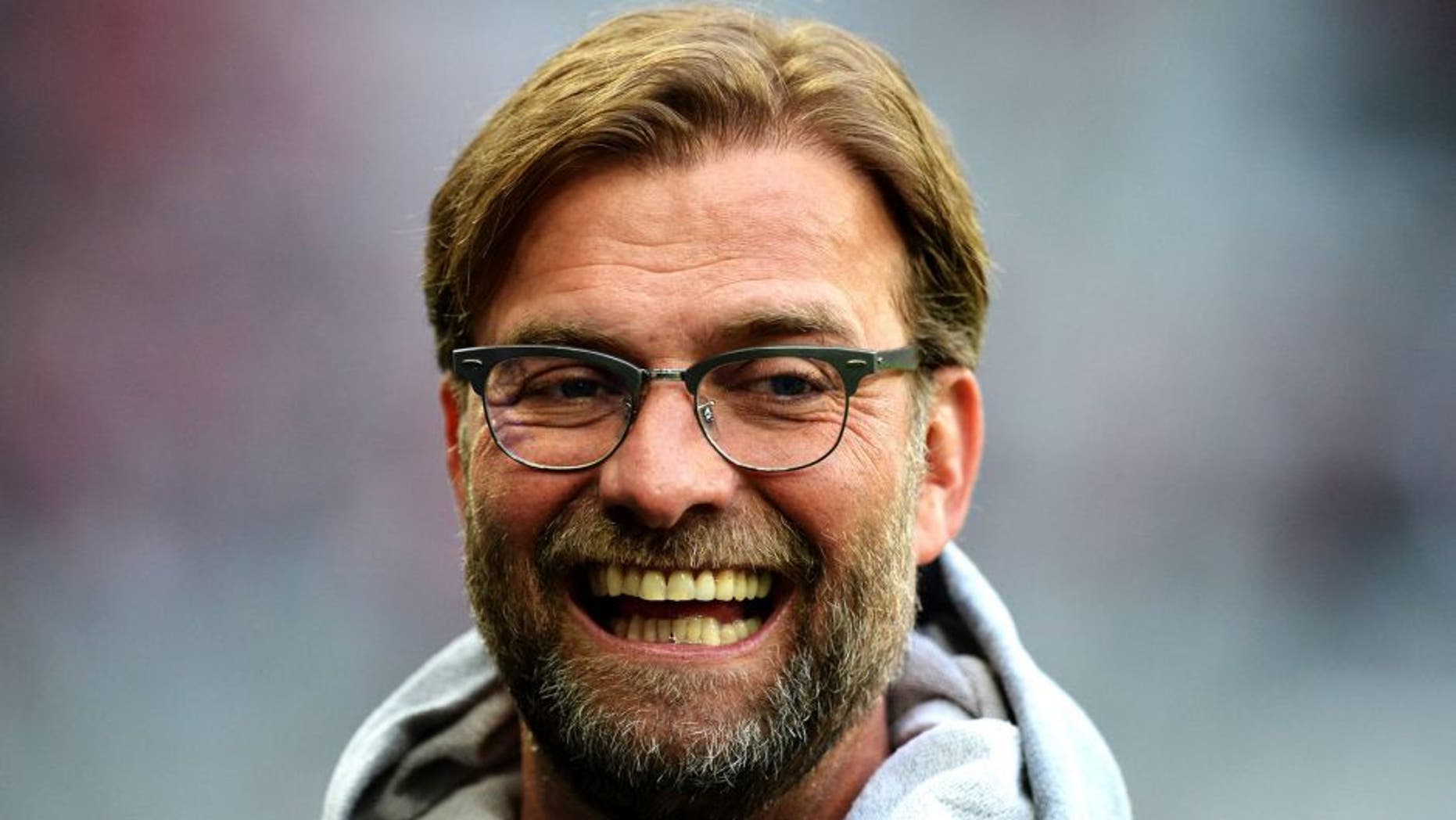 MUNICH, GERMANY - APRIL 28: Juergen Klopp head coach of Dortmund looks happy prior to thr start of the DFB Cup semi final match between FC Bayern Muenchen and Borussia Dortmund at Allianz Arena on April 28, 2015 in Munich, Germany. (Photo by Matthias Hangst/Bongarts/Getty Images)
