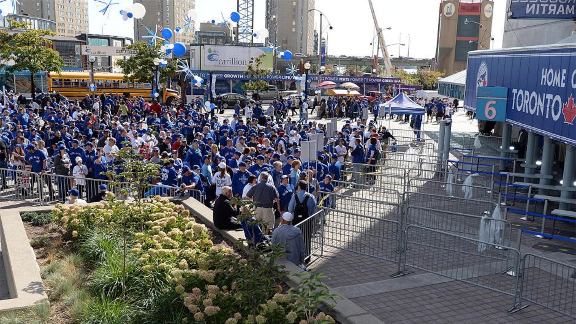 Oct 8, 2015; Toronto, Ontario, CAN; Fans of the Toronto Blue Jays line up outside the Rogers Centre prior to game one of the ALDS against the Texas Rangers. Mandatory Credit: Nick Turchiaro-USA TODAY Sports