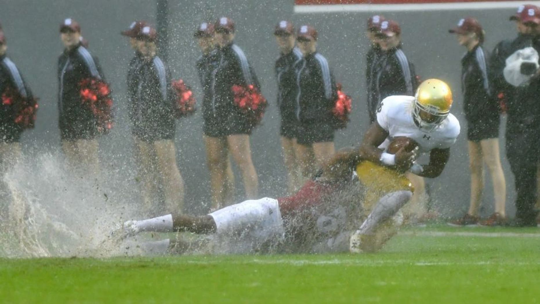 Oct 8, 2016; Raleigh, NC, USA; Notre Dame Fighting Irish wide receiver C.J. Sanders (3) is tackled by North Carolina State Wolfpack cornerback Dravious Wright (8) in the first quarter at Carter-Finley Stadium. Mandatory Credit: Matt Cashore-USA TODAY Sports