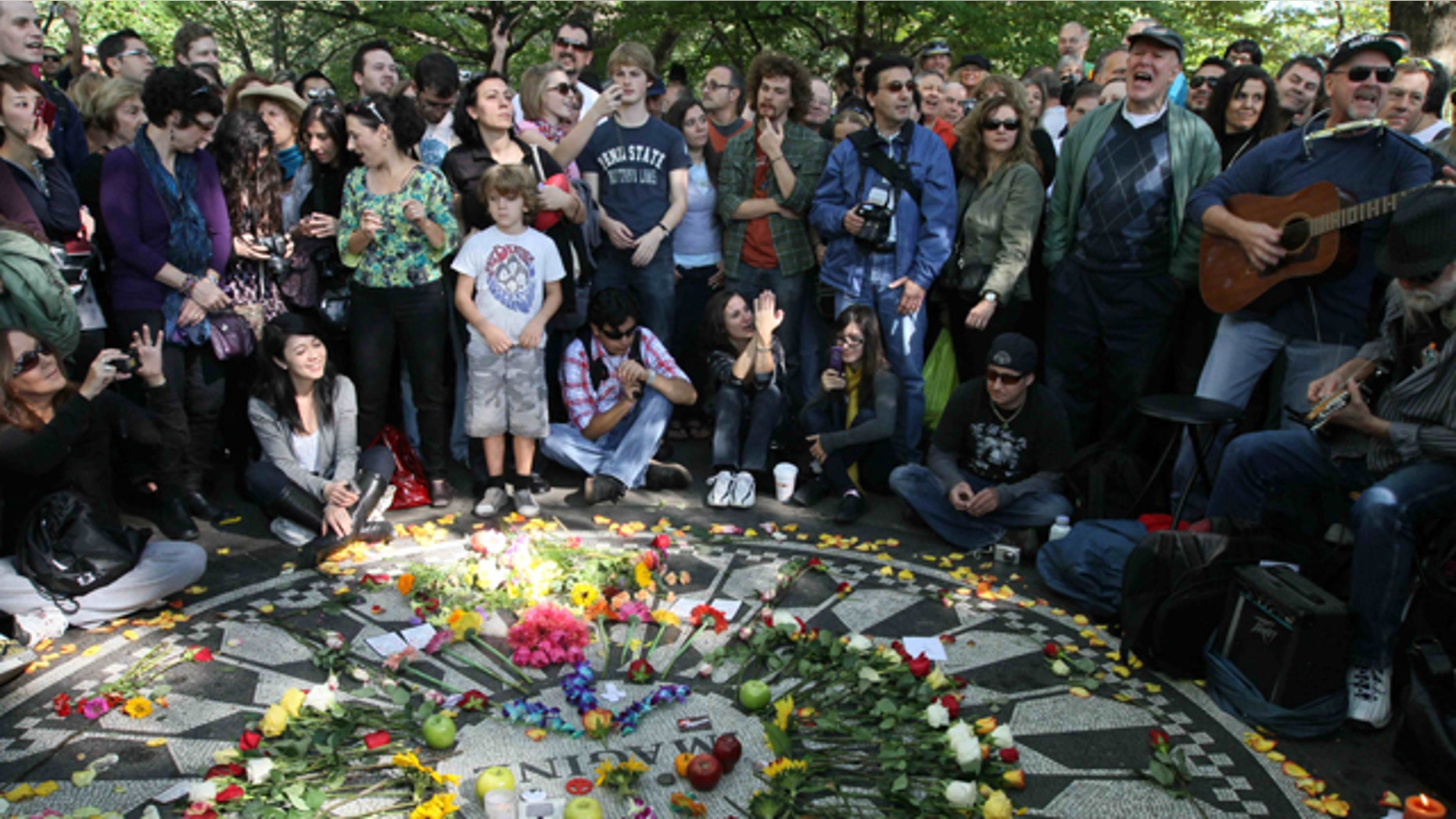 Oct. 9: People sing as they gather around the Imagine mosaic in Strawberry Fields in New York's Central Park, the day that would have been John Lennon's 70th birthday.