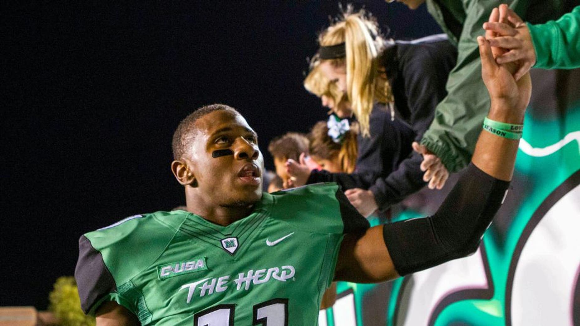 Oct 9, 2015; Huntington, WV, USA; Marshall Thundering Herd defensive back Rodney Allen (11) celebrates beating Southern Miss Golden Eagles at the end of the game at Joan C. Edwards Stadium. Marshall won the game 31-10. Mandatory Credit: Ben Queen-USA TODAY Sports