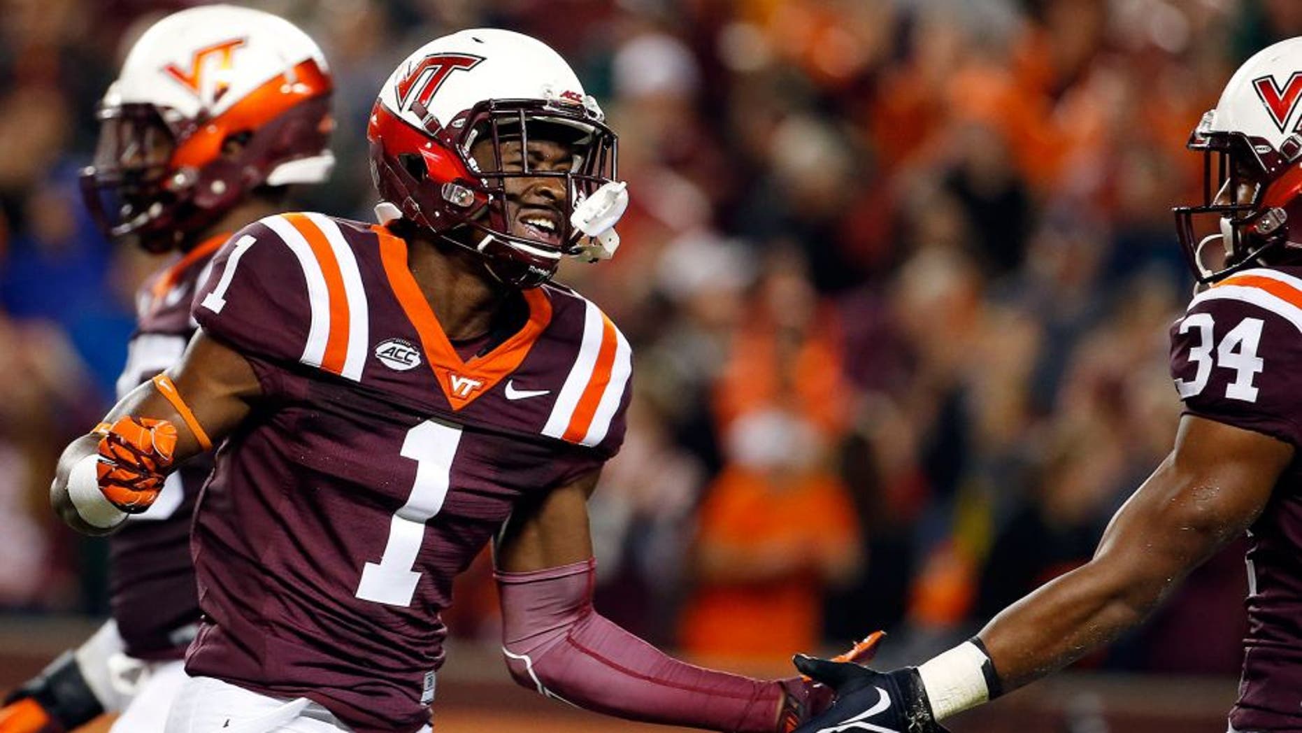 Oct 9, 2015; Blacksburg, VA, USA; Virginia Tech Hokies wide receiver Isaiah Ford (1) celebrates after scoring a touchdown against the North Carolina State Wolfpack at Lane Stadium. Mandatory Credit: Peter Casey-USA TODAY Sports